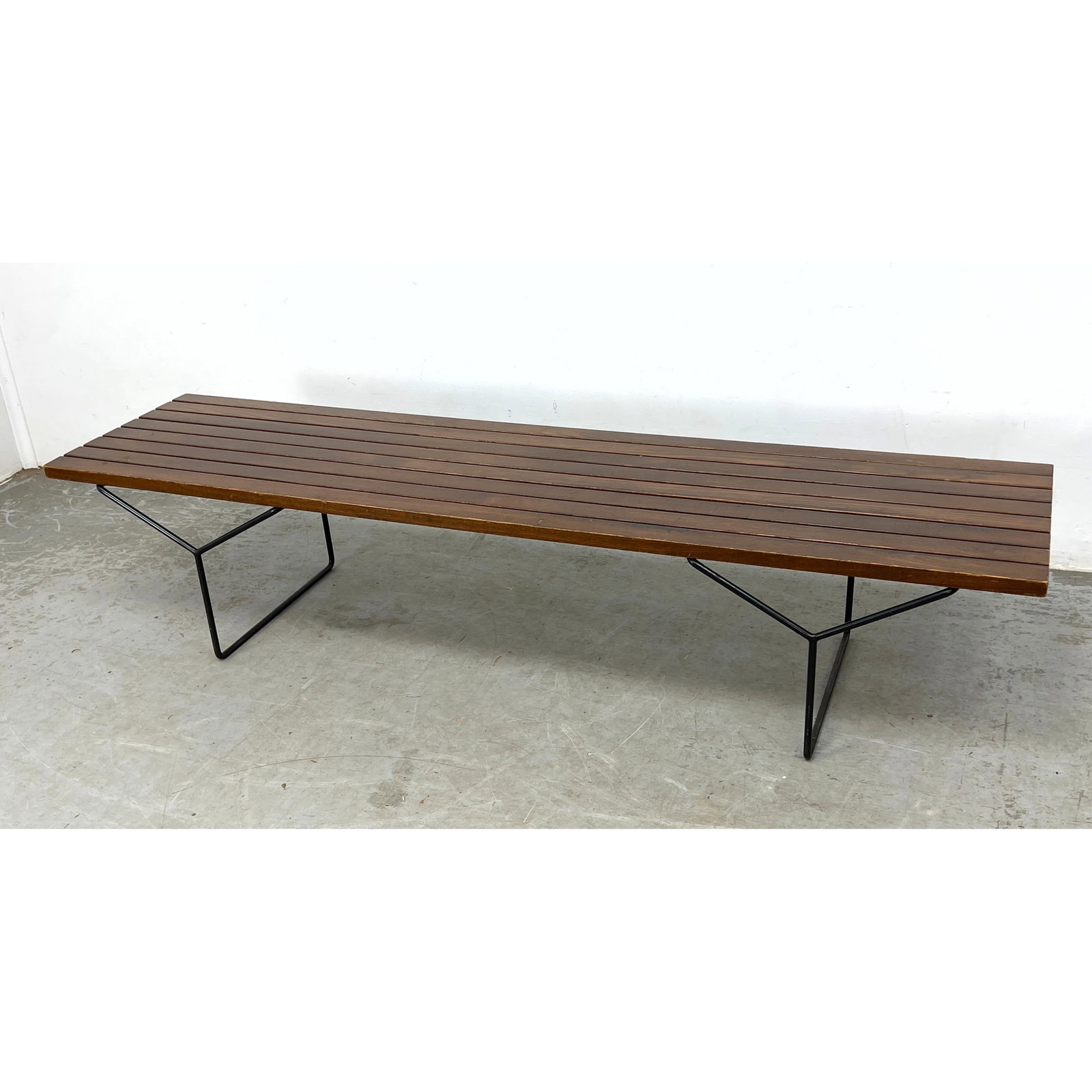 Early Vintage Model 400 slat bench designed by Harry Bertoia for Knoll Associates. Y Base Slat Bench: Early Vintage Model 400 slat bench designed by Harry Bertoia for Knoll Associates. Y Base Slat Bench Table. Black iron rod base, Dimensions: Height: 15.5 inches, Width: 72 inches, Depth: 18 inches. --