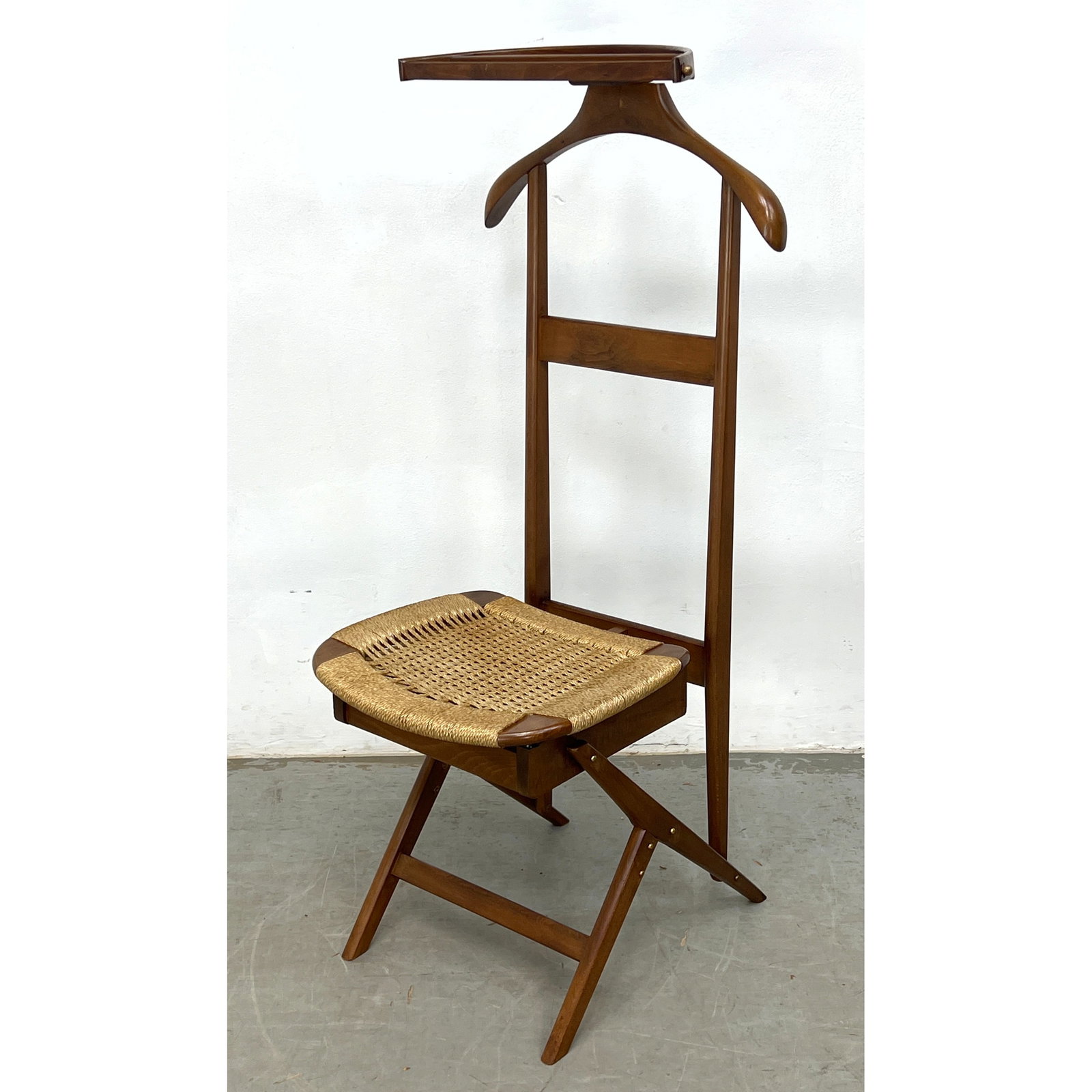 Vintage Italian Fratelli Reguitti Style Folding Valet Chair with dark stained beech wood frame and w: Vintage Italian Fratelli Reguitti Style Folding Valet Chair with dark stained beech wood frame and woven paper cord seat. Dimensions: Height: 46 inches, Width: 17 inches, Depth: 18 inches. - Seat Heig