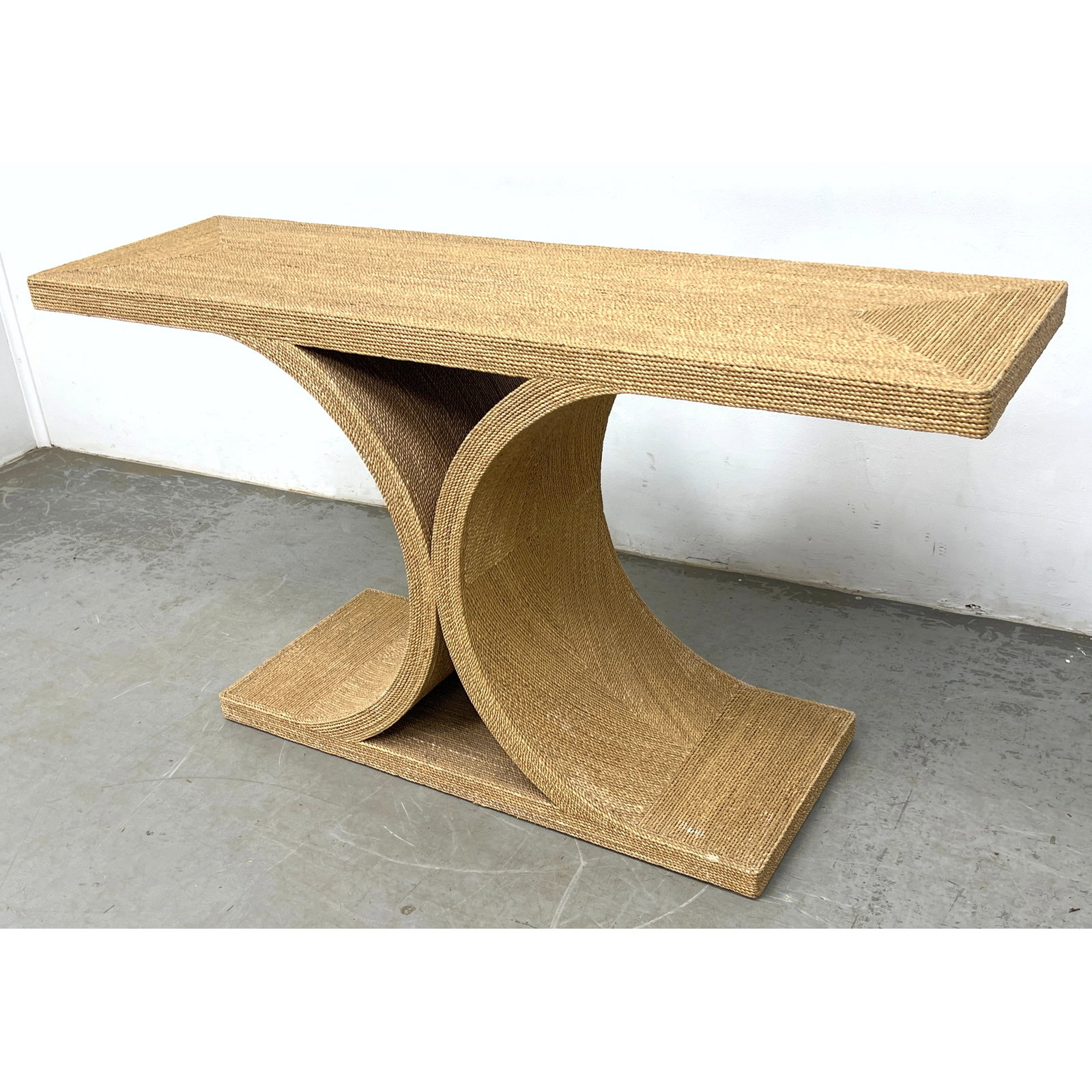 Sculptural console table features a Coastal Modern design. Wood or composite material entirely encas (1 of 9)