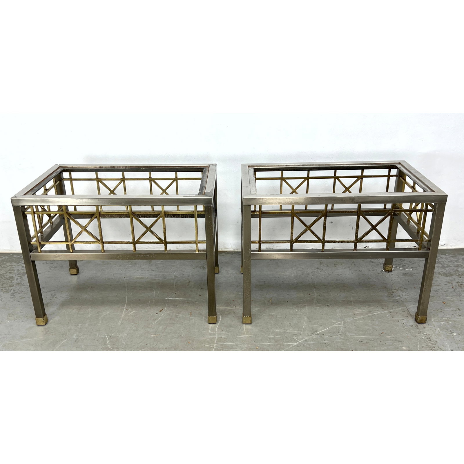 Pr Two Tone Metal Hollywood Regency Style Side Tables. Stainless square tube frames have brass box a: Pr Two Tone Metal Hollywood Regency Style Side Tables. Stainless square tube frames have brass box and "X" frieze. Dimensions: Height: 22 inches, Width: 20 inches, Depth: 29.75 inches. ---