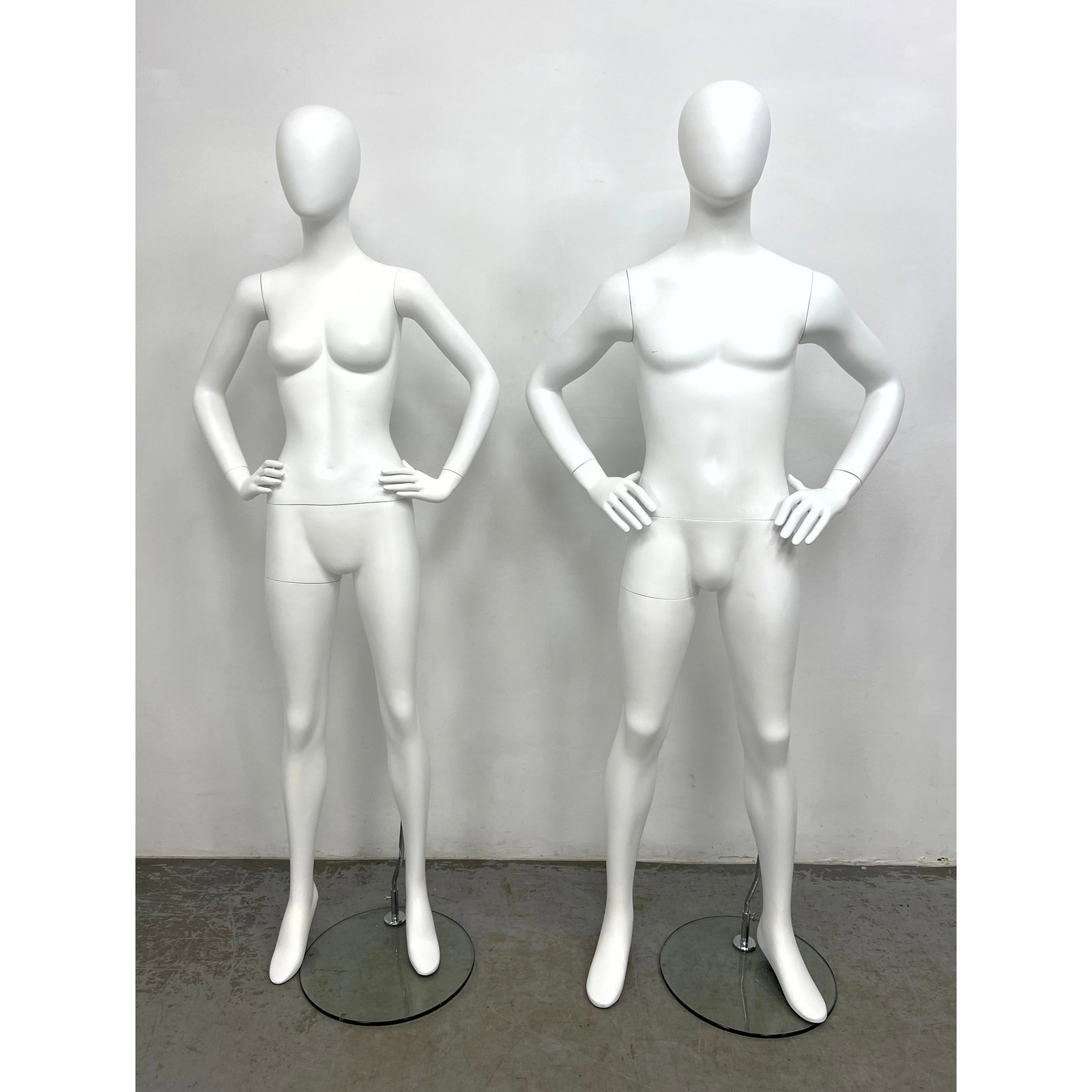 Pair of contemporary retail display mannequins comprising one male and one female form. (1 of 16)
