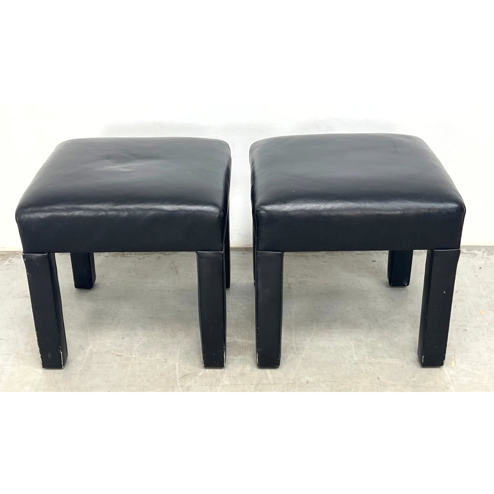 Pair of Parsons-style upholstered stools. Each stool features a square, padded seat supported by fou: Pair of Parsons-style upholstered stools. Each stool features a square, padded seat supported by four square-section legs that are flush with the seat frame, Dimensions: Height: 16 inches, Width: 16 i