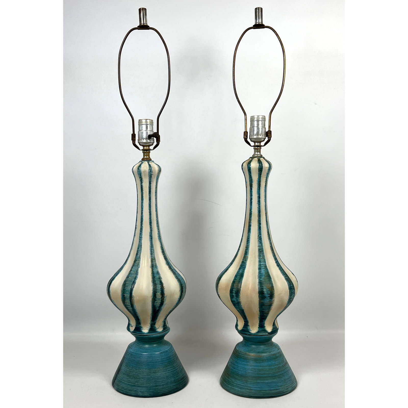 Pair Mid Century Modern Table Lamps.: Pair Mid Century Modern Table Lamps. Dimensions: Height: 31 inches, Width: 7 inches, Depth: 7 inches. --- US Packing and Shipping charge: In house shipping available. Will be calculated once destinati