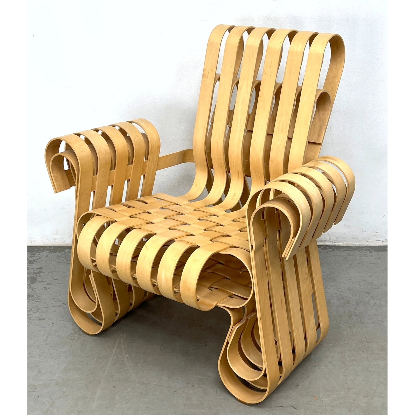 DAY 2 Power Play armchair designed by architect Frank Gehry for Knoll. Interwoven strips of thermofo: DAY 2 Power Play armchair designed by architect Frank Gehry for Knoll. Interwoven strips of thermoformed maple Dimensions: Height: 33 inches, Width: 33.5 inches, Depth: 27 inches. - Seat Height: 16.5 