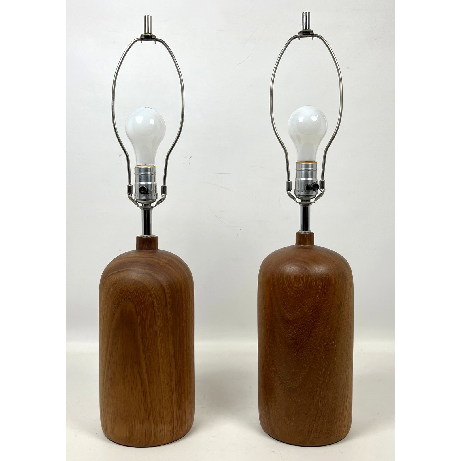 Pair Vintage Danish Modern Teak Table Lamps: Pair Vintage Danish Modern Teak Table Lamps Dimensions: Height: 25 inches, Width: 6 inches, Depth: 6 inches. ---