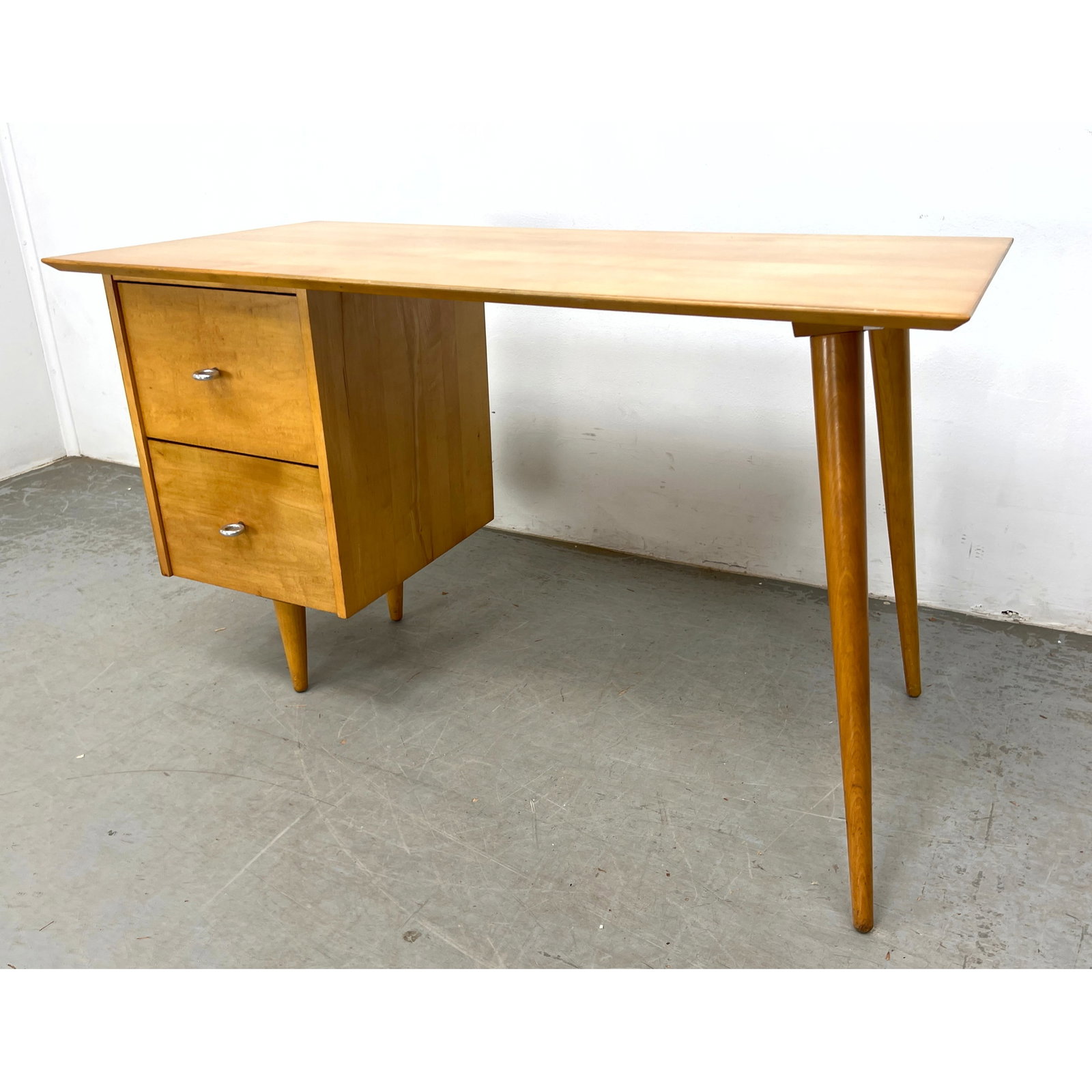 Paul McCobb for the Planner Group line writing Desk. Ring pulls.: Paul McCobb for the Planner Group line writing Desk. Ring pulls. Dimensions: Height: 29.5 inches, Width: 48 inches, Depth: 24 inches. ---