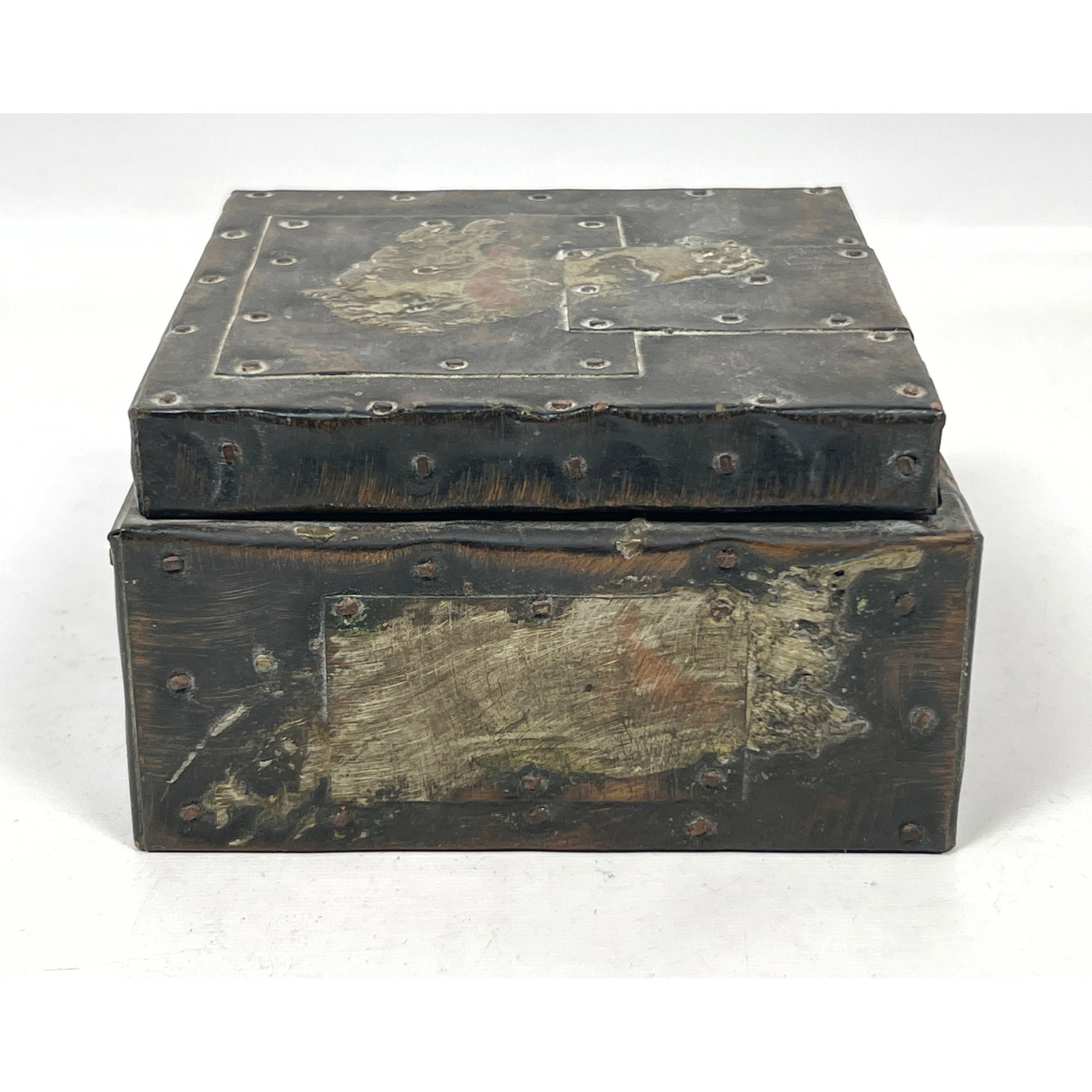 Attributed to Paul Evans cork lined tobacco trinket box with hinged lid. Brutalist applied metal. Un: Attributed to Paul Evans cork lined tobacco trinket box with hinged lid. Brutalist applied metal. Unsigned. Dimensions: Height: 3.5 inches, Width: 6 inches, Depth: 6 inches. ---