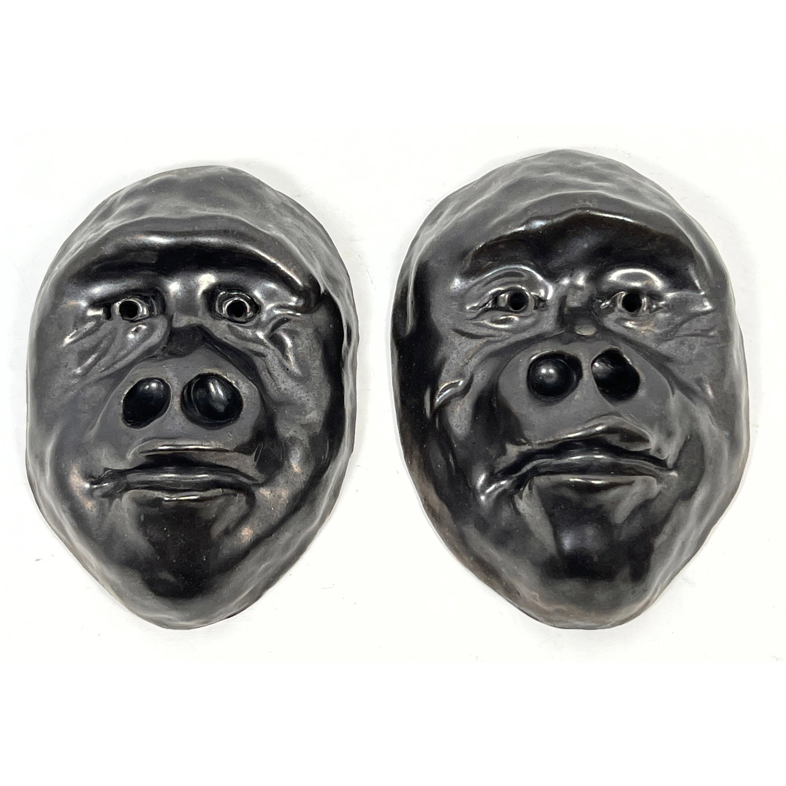 Pair Studio Pottery Glazed Earthen Simeon Wall Masks, Signed Robinson. Gorilla faces: Pair Studio Pottery Glazed Earthen Simeon Wall Masks, Signed Robinson. Gorilla faces Dimensions: Height: 10.5 inches, Width: 7.5 inches, Depth: 4 inches. ---