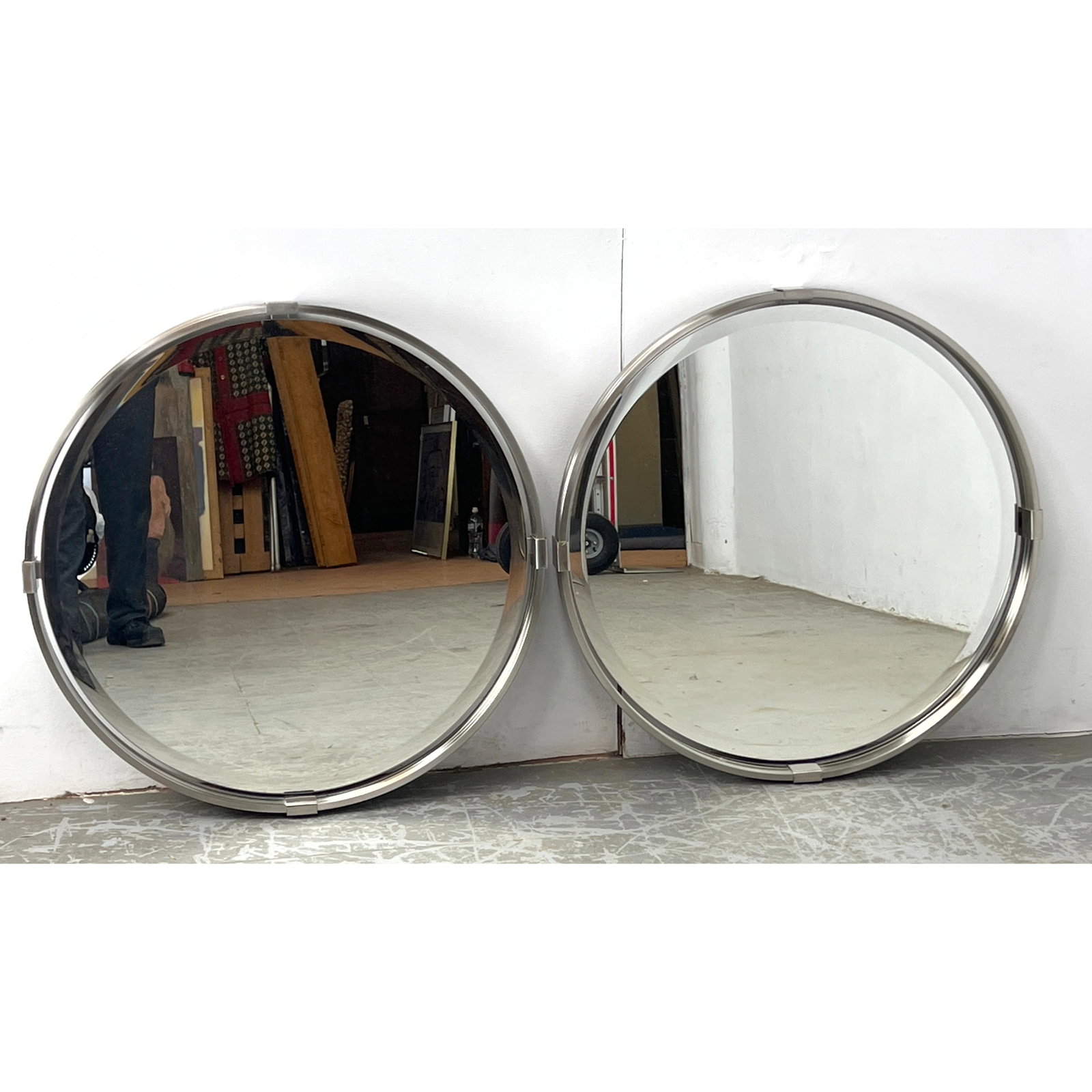 Pair Uttermost Round Wall Mirrors. 4 Band Brushed Nickel Frames. Heavy construction.: Pair Uttermost Round Wall Mirrors. 4 Band Brushed Nickel Frames. Heavy construction. Dimensions: Height: 29.5 inches, Width: 29.5 inches, Depth: 2.5 inches. ---