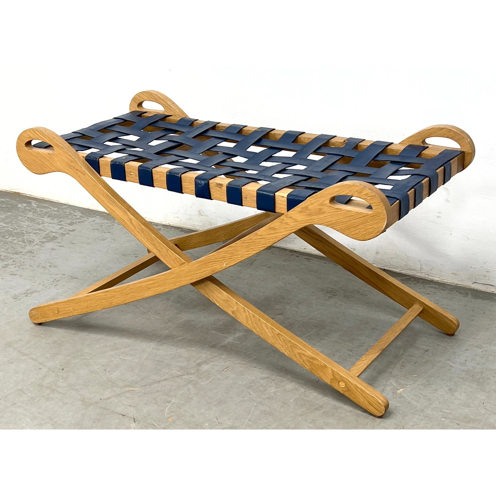 Mid-Century Campaign Style Oak and Leather Strap Bench. Saber form.: Mid-Century Campaign Style Oak and Leather Strap Bench. Saber form. Dimensions: Height: 19 inches, Width: 36.5 inches, Depth: 18 inches. ---