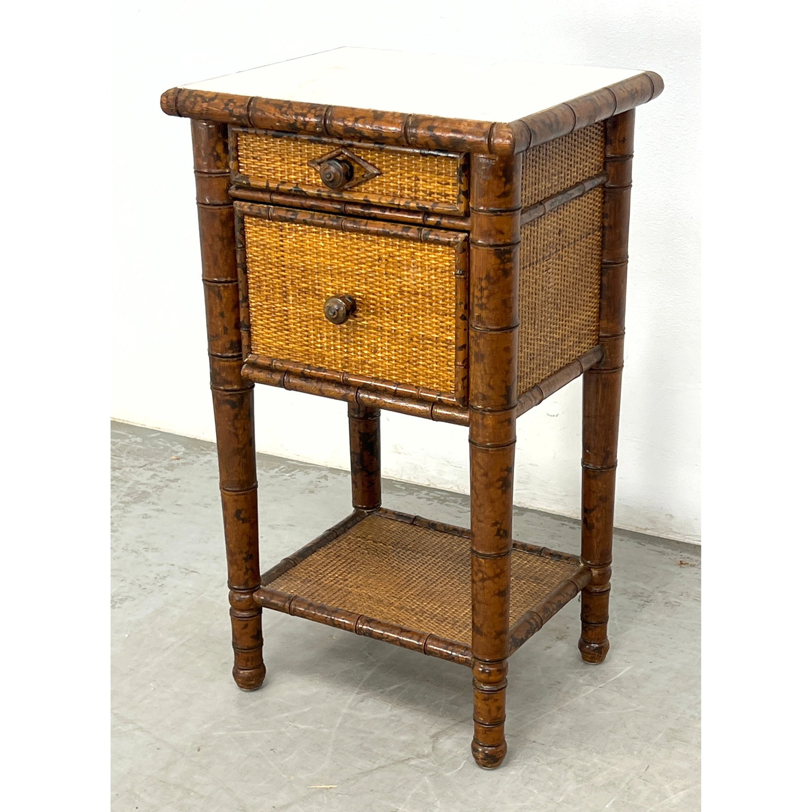 Tommy Bahama Attributed Bamboo Rattan Side Table with Inset Marble.: Tommy Bahama Attributed Bamboo Rattan Side Table with Inset Marble. Dimensions: Height: 31 inches, Width: 18 inches, Depth: 15 inches. ---