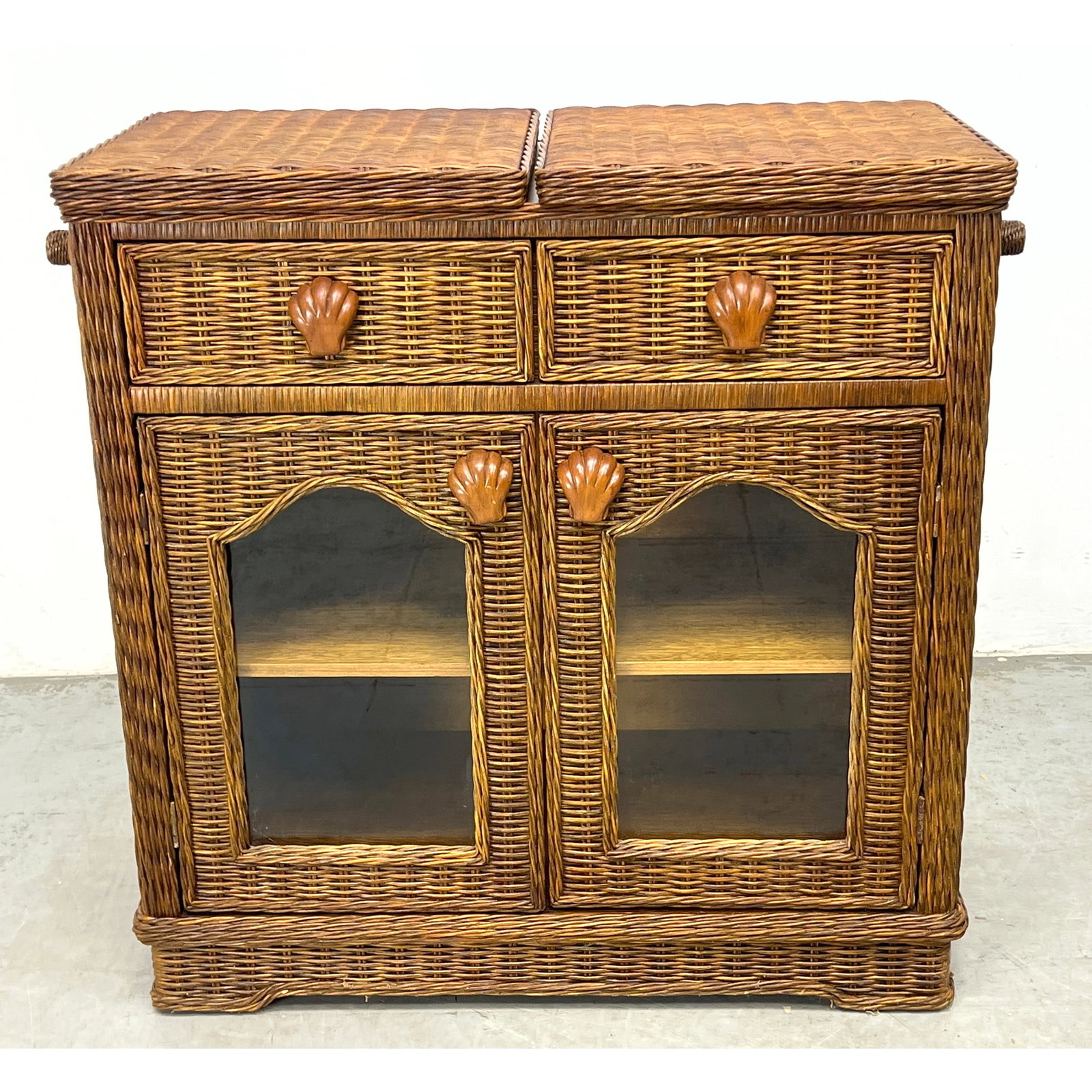 Woven Wicker Rattan Flip Top Bar Cabinet.: Woven Wicker Rattan Flip Top Bar Cabinet. . Includes: 2 - 17 inch leaves Dimensions: Height: 35 inches, Width: 37 inches, Depth: 18 inches. ---