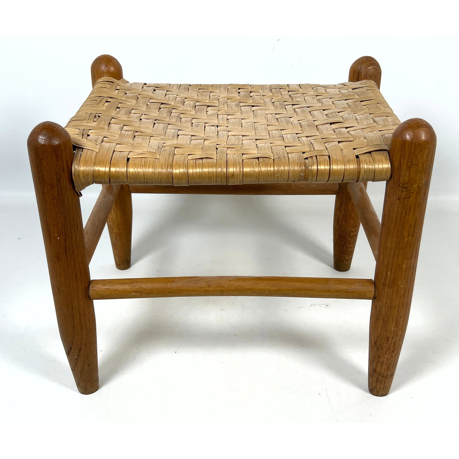 Small Vintage Rustic Stool. Woven rattan top.: Small Vintage Rustic Stool. Woven rattan top. Dimensions: Height: 11 inches, Width: 13 inches, Depth: 10.5 inches. ---