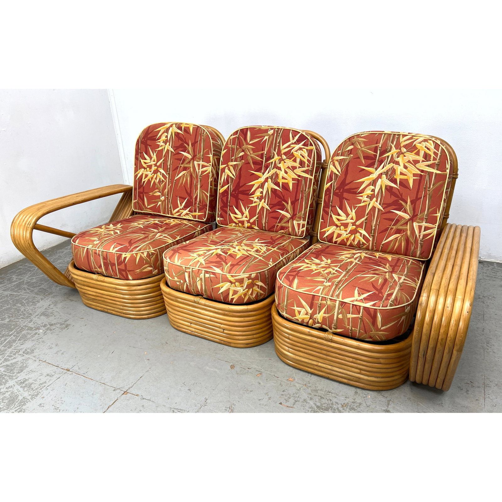 Paul Frankl 6 Band Rattan 3 Section sofa manufactured by Tochiku Industry Co., Ltd. of Tokyo, Japan,: Paul Frankl 6 Band Rattan 3 Section sofa manufactured by Tochiku Industry Co., Ltd. of Tokyo, Japan, Dimensions: Height: 32 inches, Width: 79 inches, Depth: 39 inches. - Seat Height: 15 inches ---