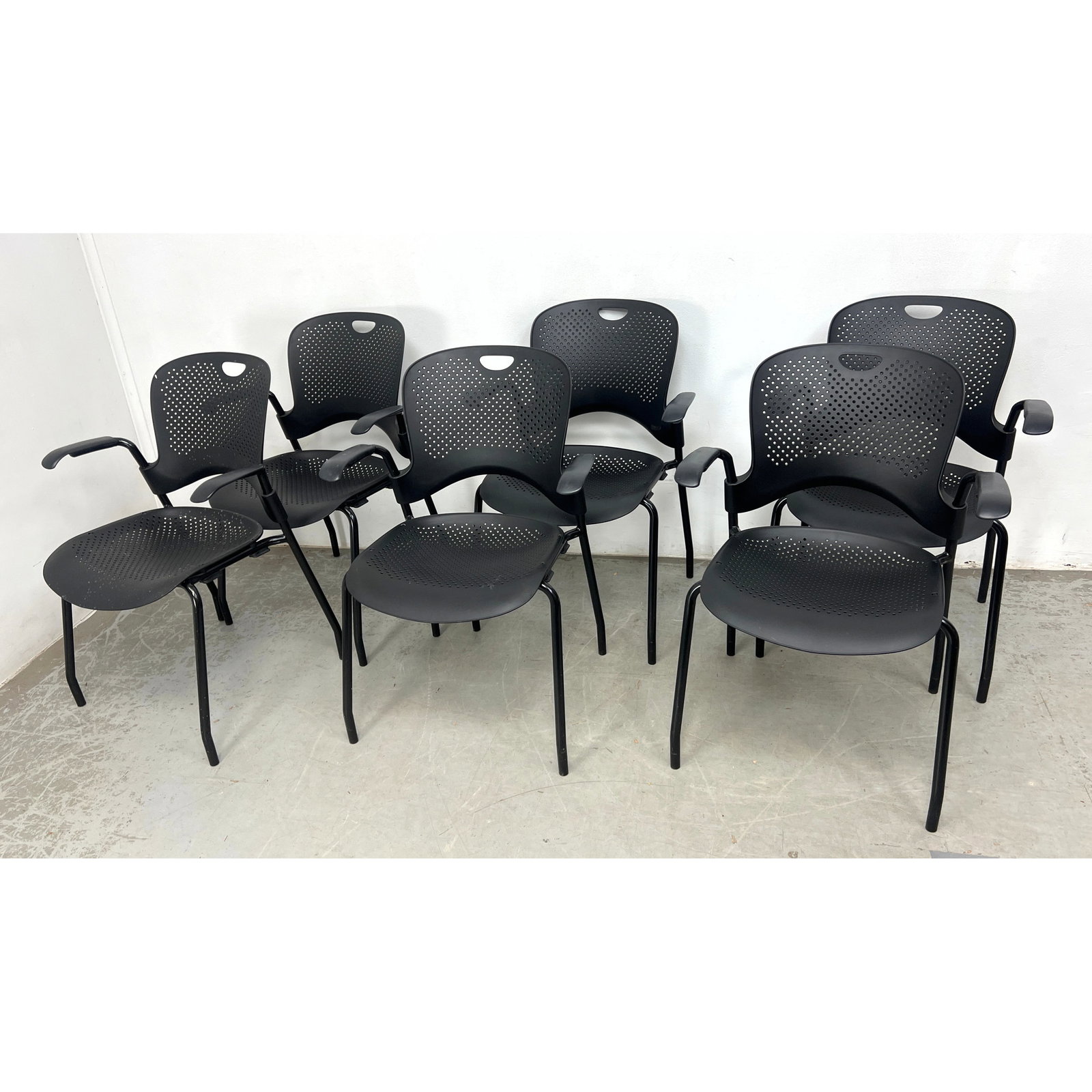 Set 6 Herman Miller Caper stacking armchairs in an all-black colorway: Set 6 Herman Miller Caper stacking armchairs in an all-black colorway Dimensions: Height: 32 inches, Width: 24 inches, Depth: 22.5 inches. - Seat Height: 16 inches ---