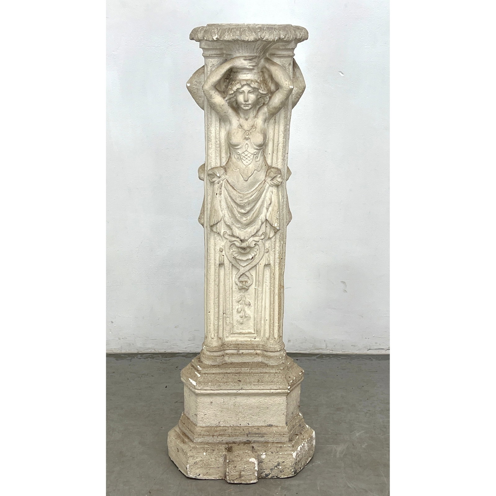 Decorative cast stone pedestal featuring a female caryatid figure in high relief. (1 of 9)