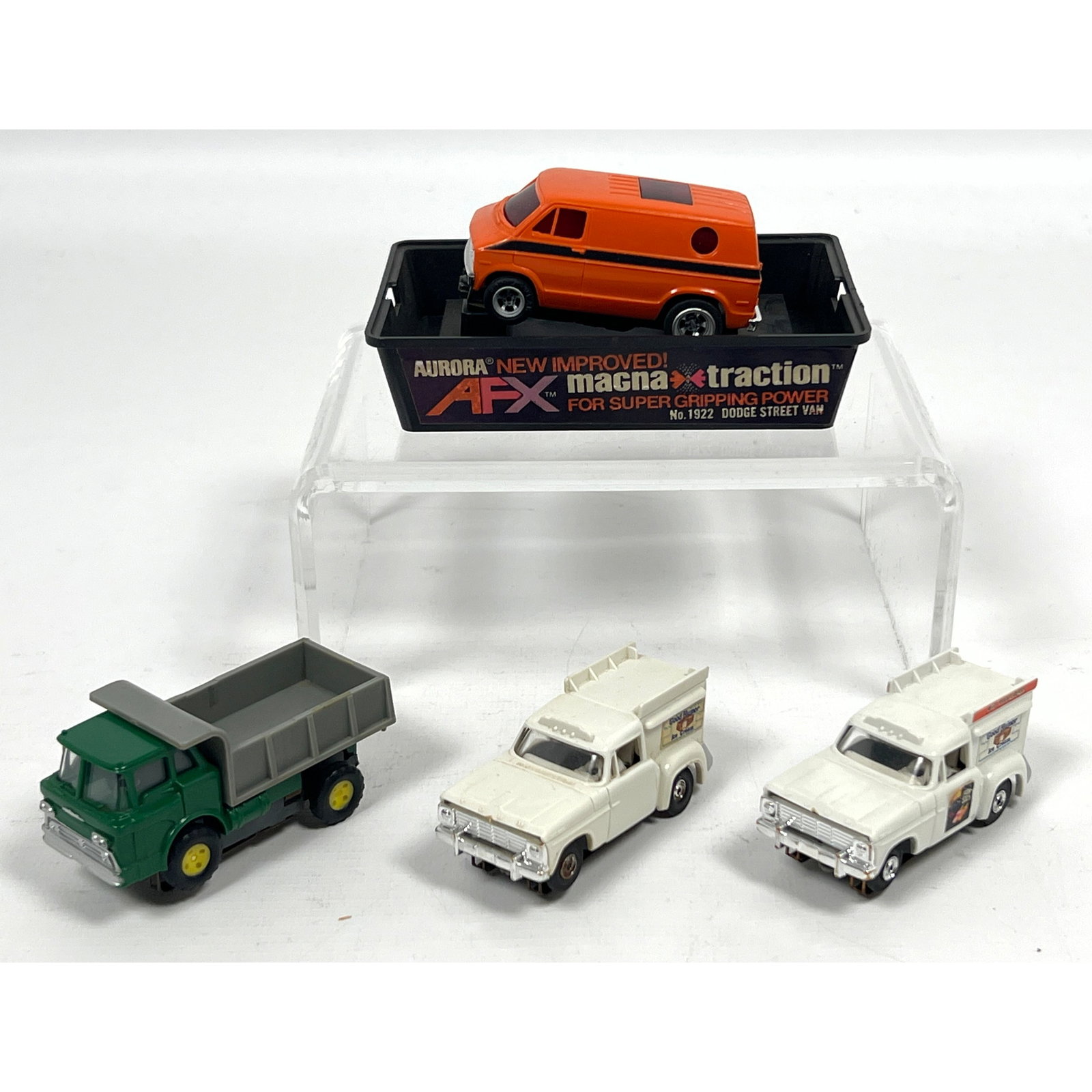 Collection including four HO-scale slot cars produced by Aurora for the AFX line. The first vehicle (1 of 20)