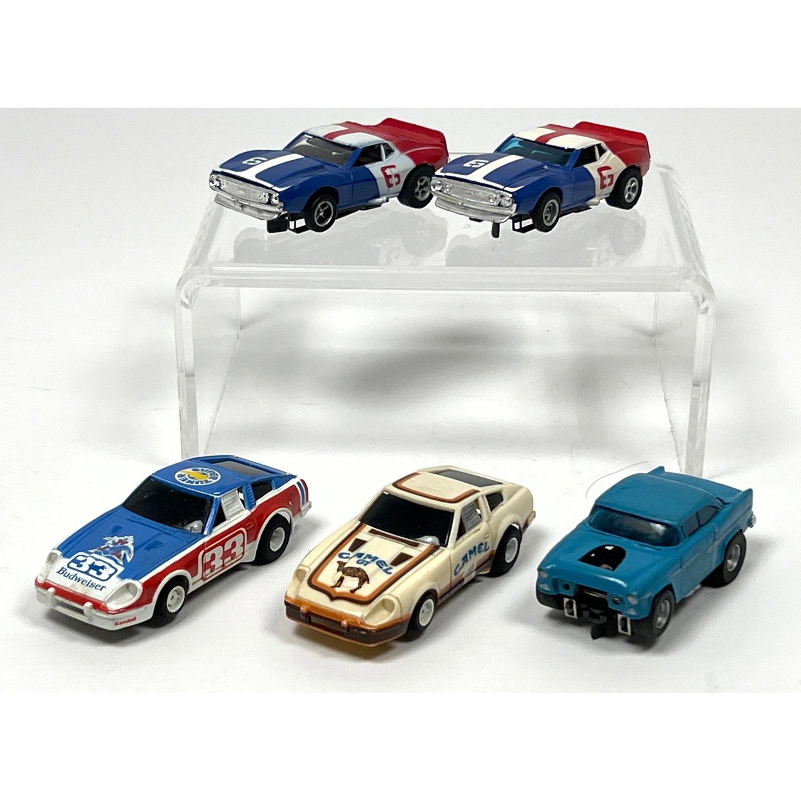 5 HO scale electric slot cars featuring molded plastic bodies and various performance chassis. The g (1 of 16)