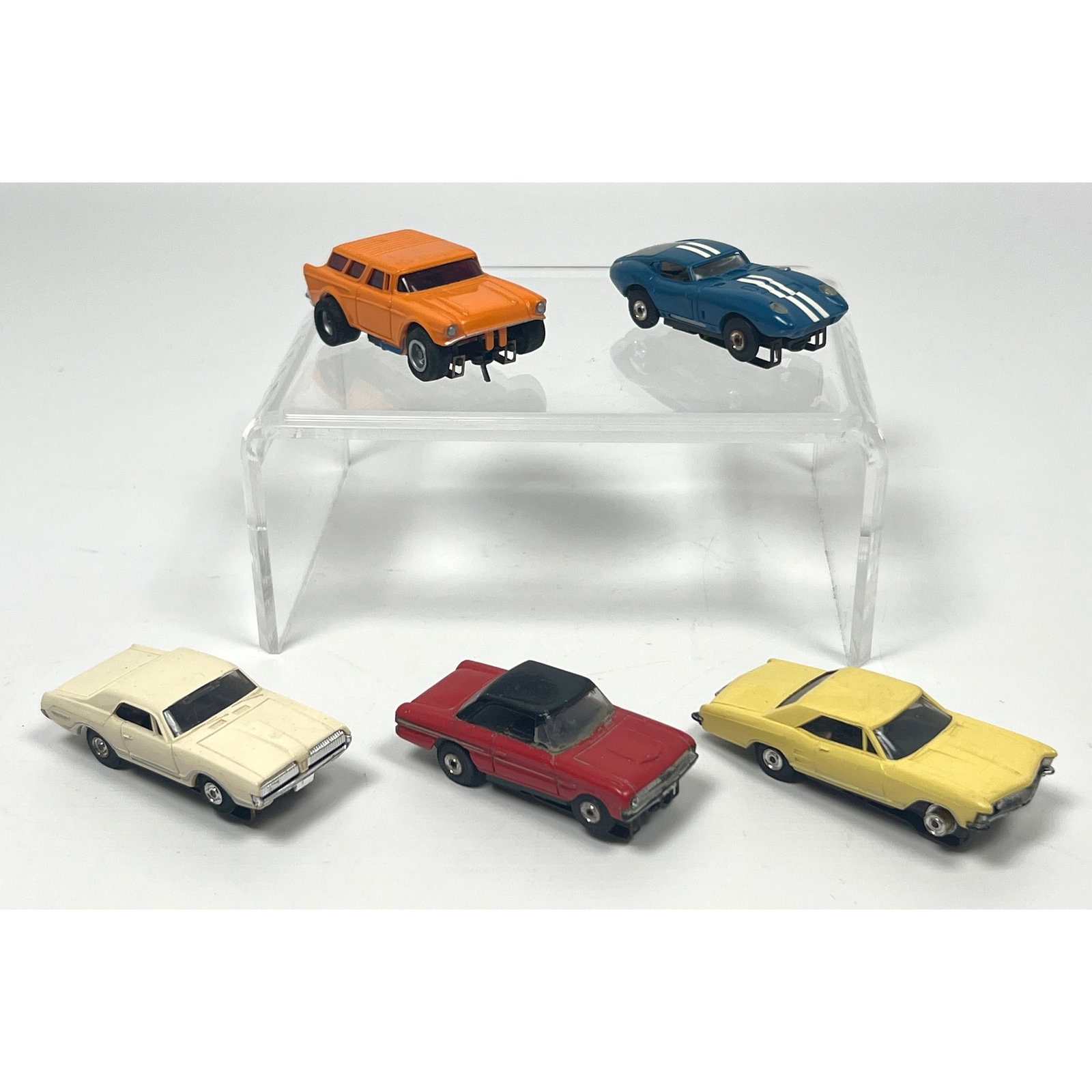 5 vintage HO scale electric slot cars featuring various mid-20th century automotive models. The grou (1 of 19)