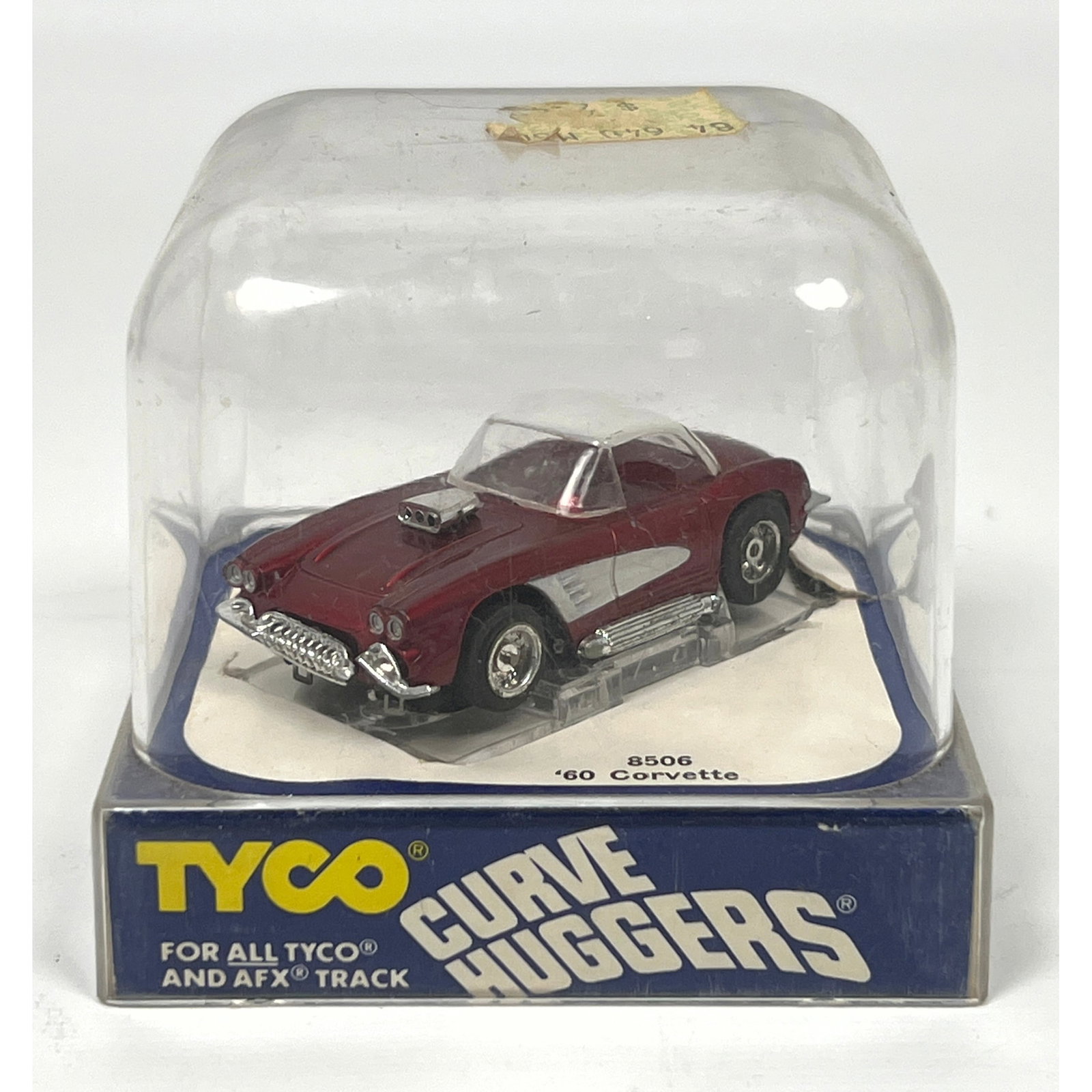 HO scale electric slot car was manufactured by Tyco as part of the Curve Huggers series. The model i: HO scale electric slot car was manufactured by Tyco as part of the Curve Huggers series. The model is a 1960 Chevrolet Corvette, identified by item number 8506. The vehicle features a plastic body and