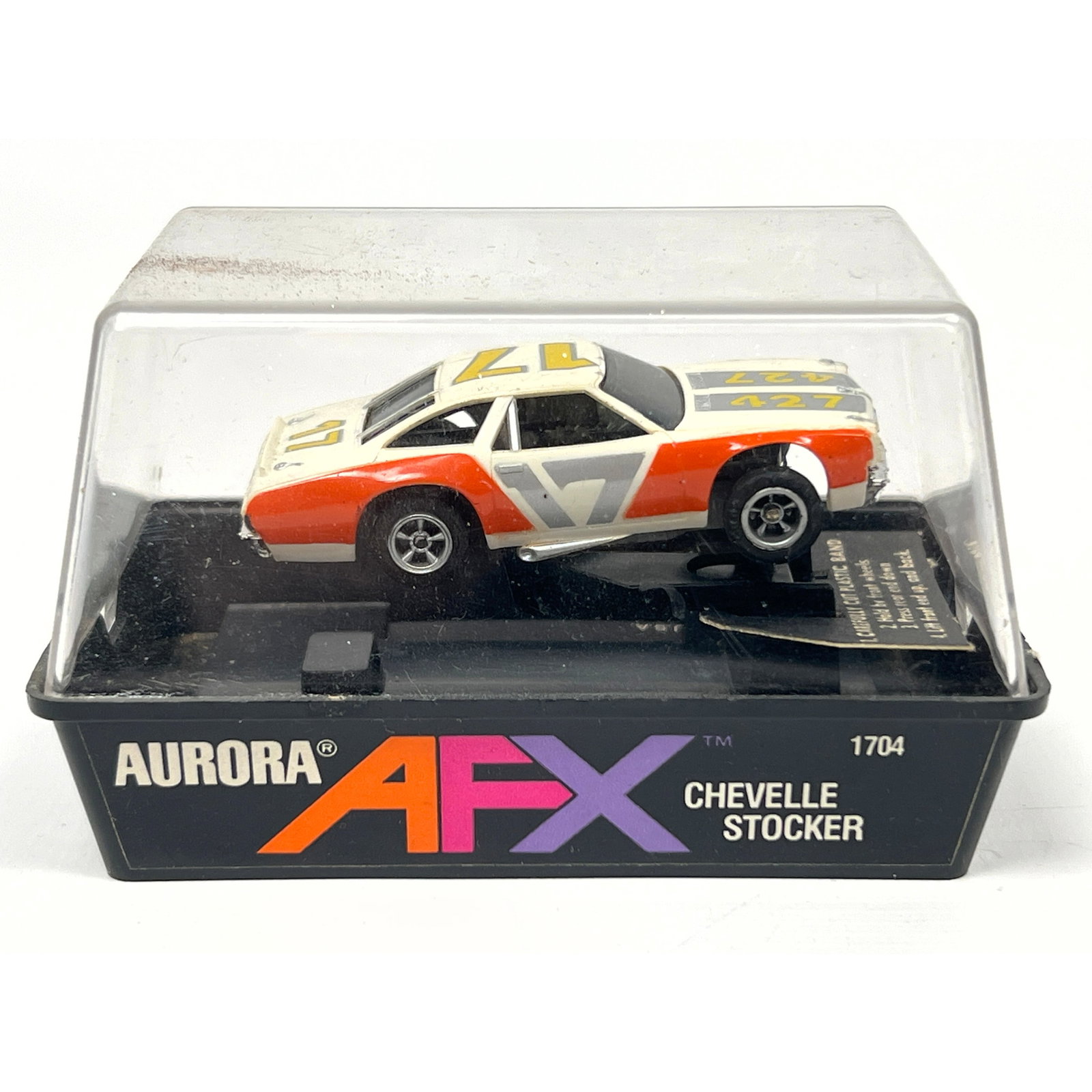 Aurora AFX slot car is the Chevrolet Chevelle 427 Stocker model, catalog number 1704. The vehicle is: Aurora AFX slot car is the Chevrolet Chevelle 427 Stocker model, catalog number 1704. The vehicle is constructed with a molded plastic body and a plastic and metal chassis. The exterior features a whi