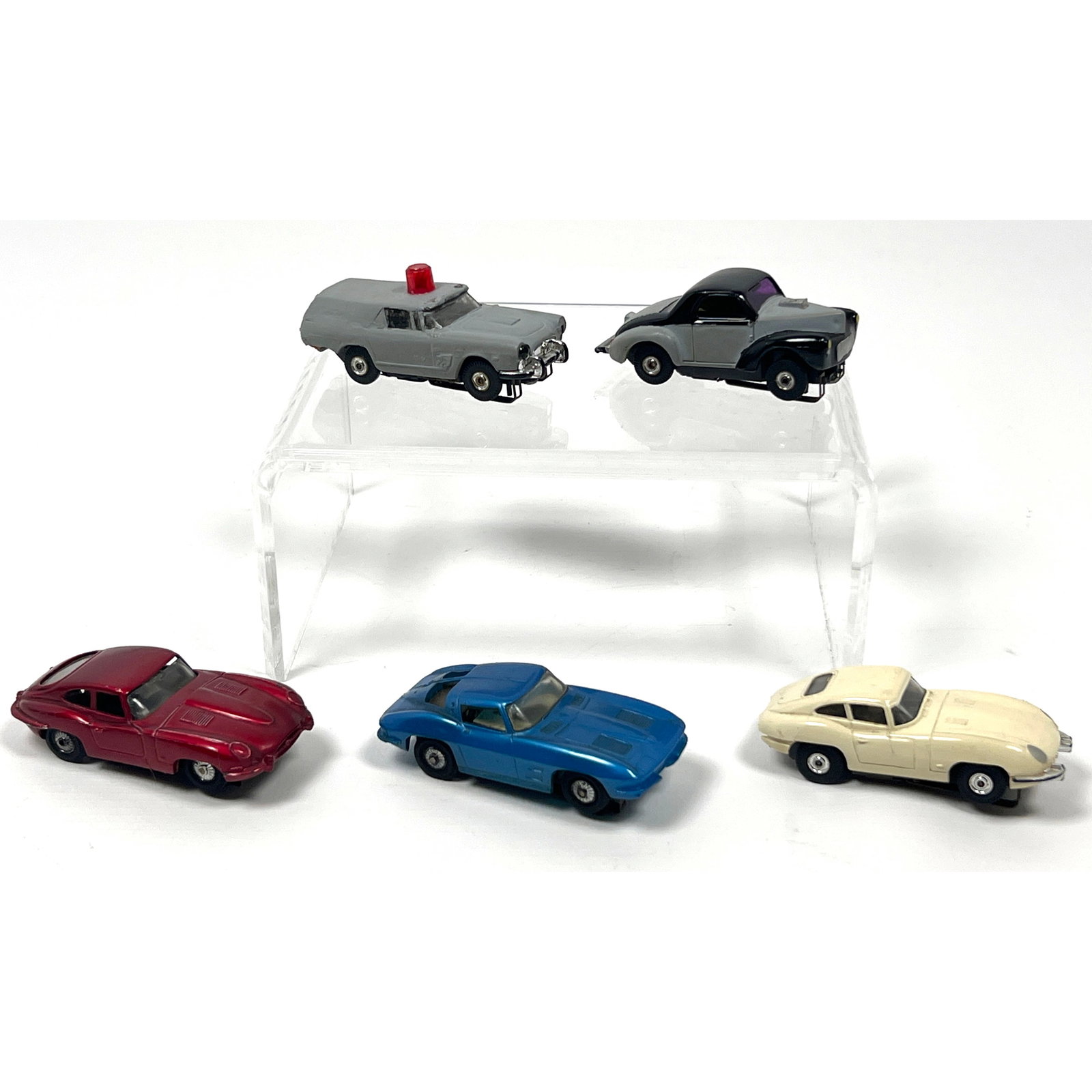 5 HO scale slot cars includes models by Tyco and other manufacturers. Two vehicles are identified by (1 of 17)
