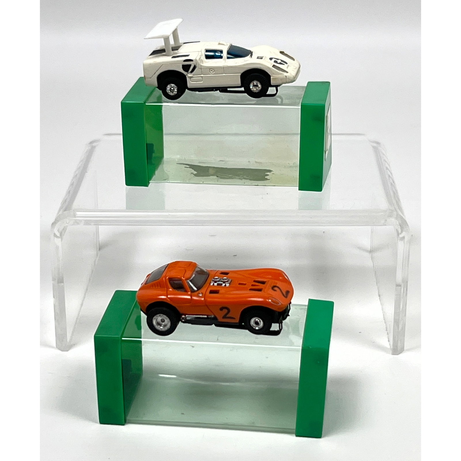2 Vintage HO scale slot cars produced by Aurora, identified as part of the T-Jet or Tuff Ones series (1 of 14)