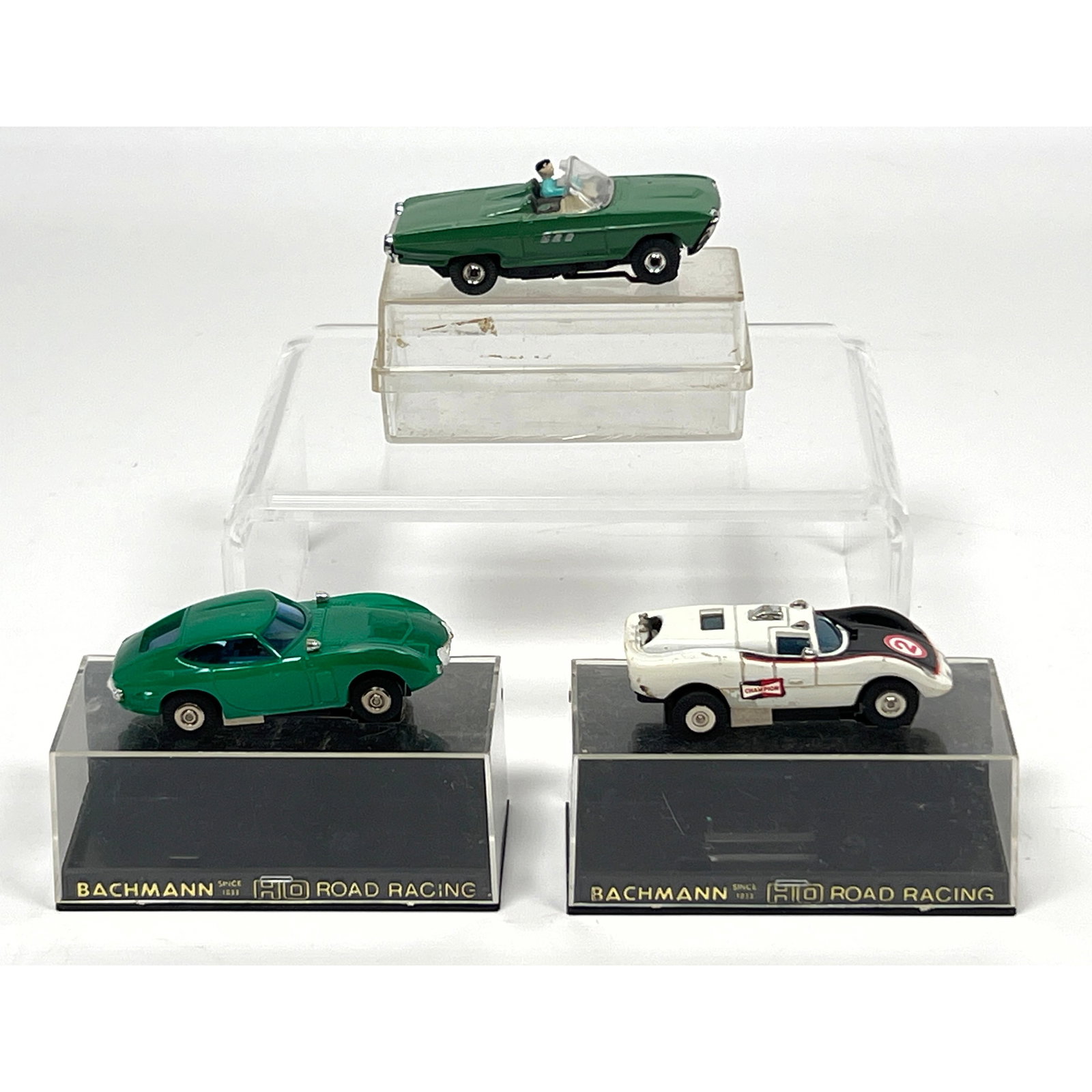 3 vintage HO scale electric slot cars, including two models from the Bachmann Groove Busters Racing: 3 vintage HO scale electric slot cars, including two models from the Bachmann Groove Busters Racing Team series and one Ford Thunderbird convertible. The first car is a Bachmann Toyota 2000 GT, catalo