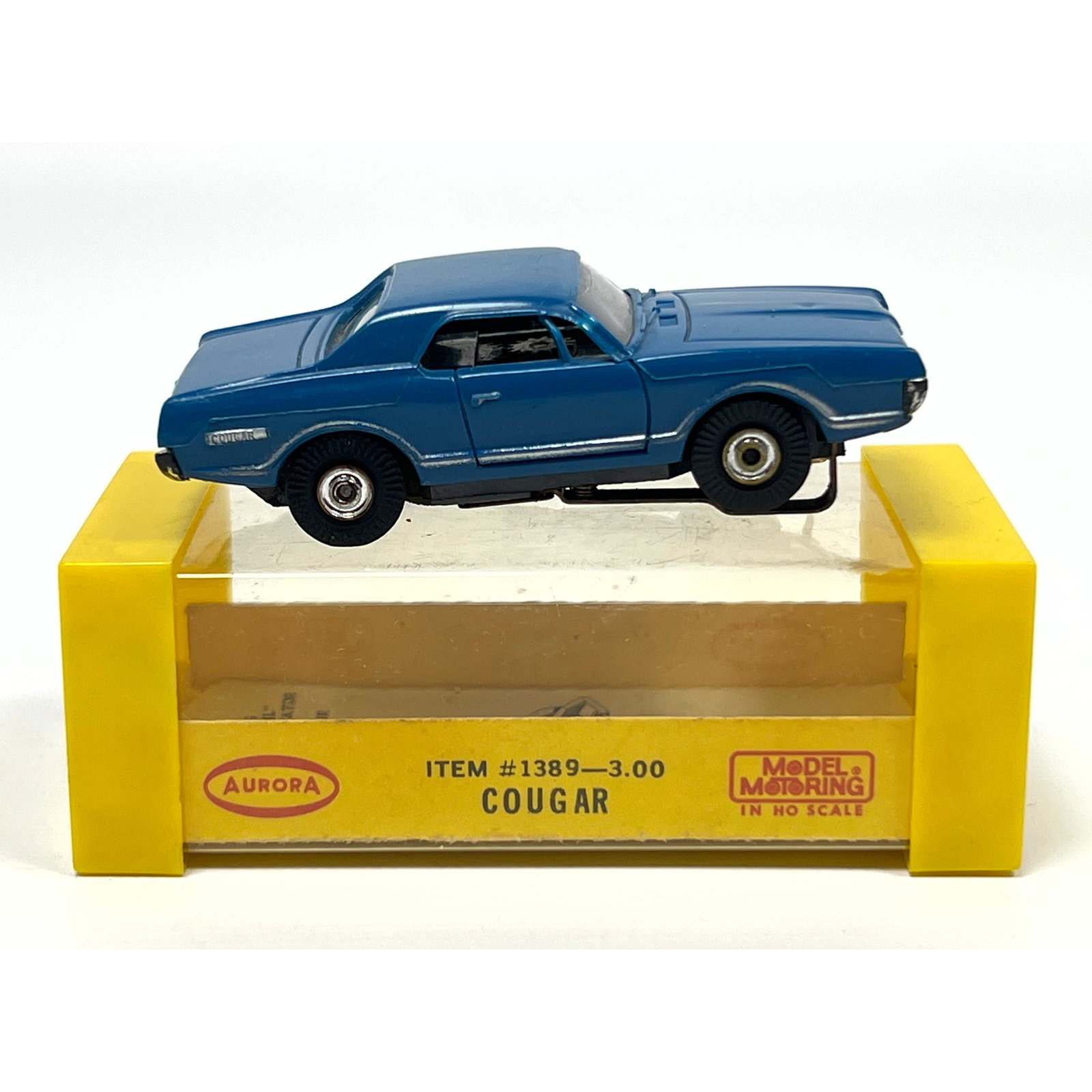 Aurora Model Motoring HO scale electric slot car featuring a Mercury Cougar body. The vehicle is con (1 of 11)