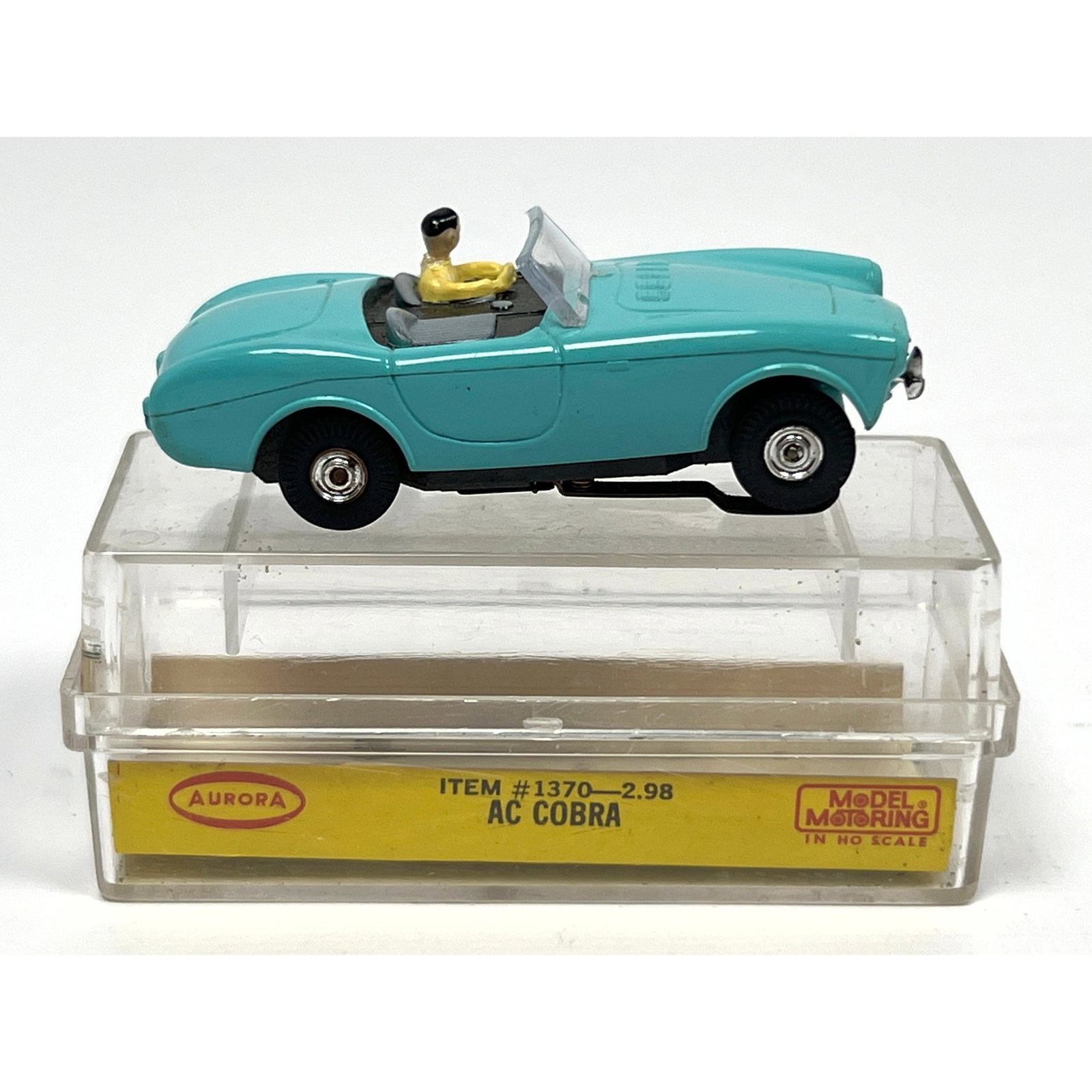 Aurora Plastics Corp. Model Motoring HO scale slot car features an AC Cobra body mounted on a Thunde (1 of 10)