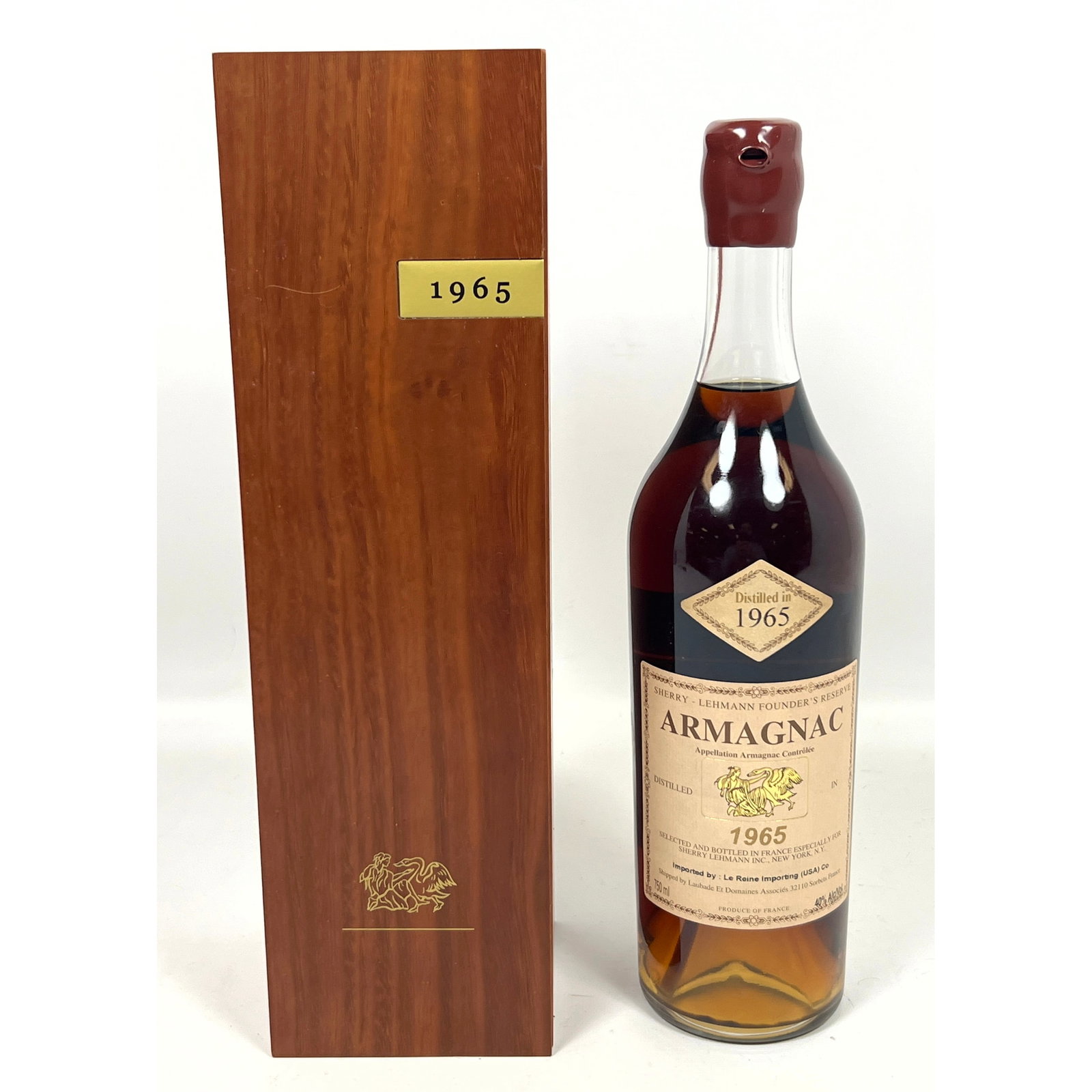 750 ml bottle of Armagnac 1965, designated as Sherry-Lehmann Founder's Reserve, was produced by Laub: 750 ml bottle of Armagnac 1965, designated as Sherry-Lehmann Founder's Reserve, was produced by Laubade Et Domaines Associ?s in Sorbets, France, Dimensions: Height: 13.75 inches, Width: 4 inches, Dept