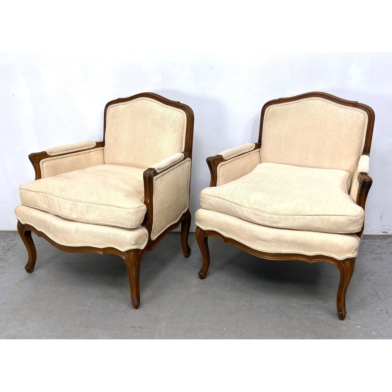 Pair Baker Fruitwood Bergeres Lounge Chairs.: Pair Baker Fruitwood Bergeres Lounge Chairs. Dimensions: Height: 32 inches, Width: 28 inches, Depth: 23 inches. - Seat Height: 19 inches ---