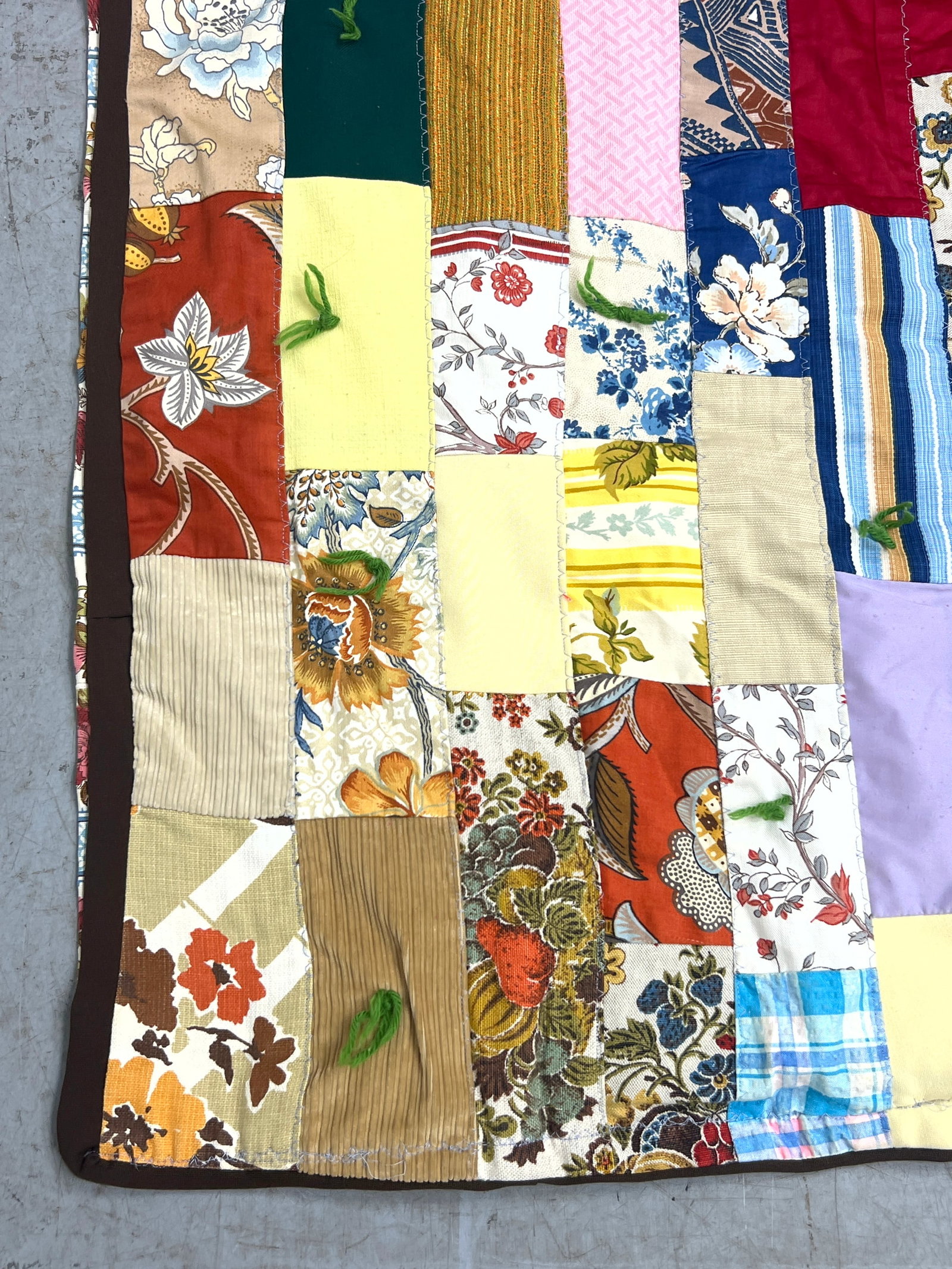 Vintage patchwork tied quilt features a staggered rectangular block. Machine made. - 5