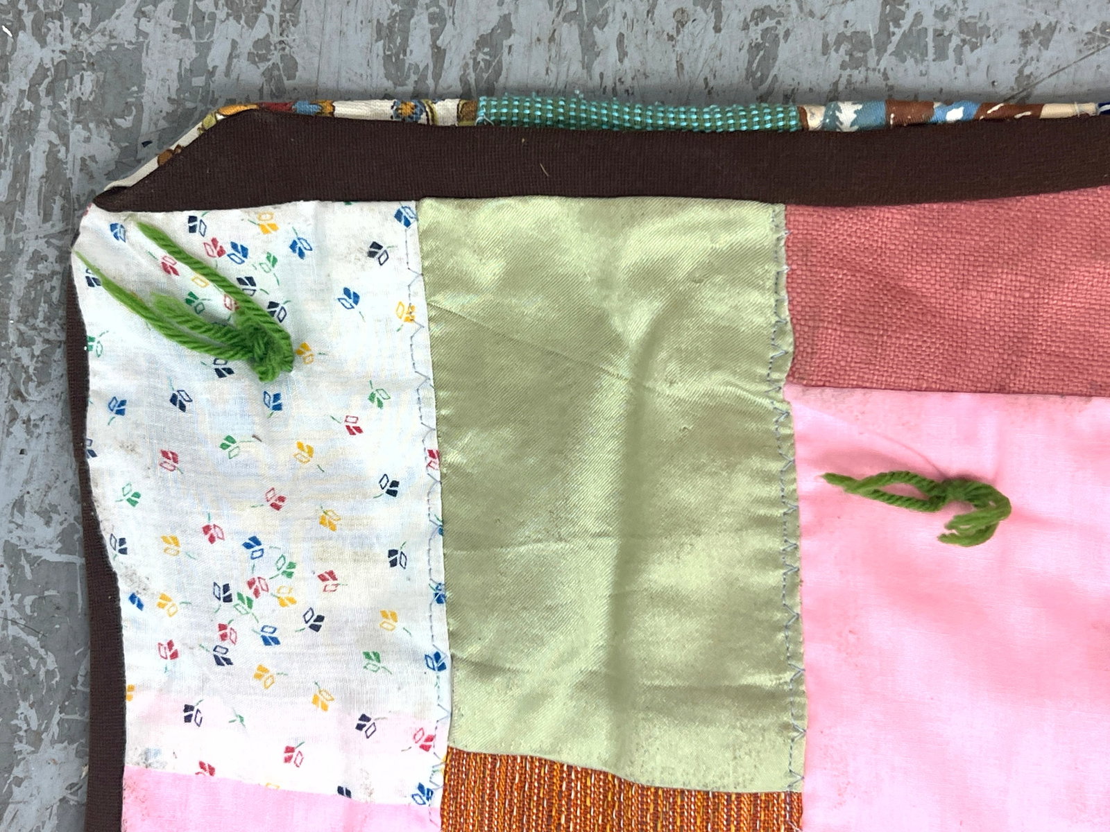 Vintage patchwork tied quilt features a staggered rectangular block. Machine made. - 6
