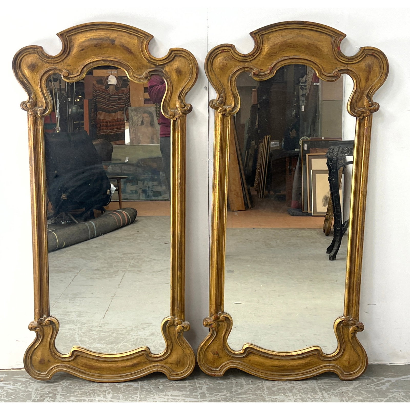 Pair of tall vertical wall mirrors in the Rococo Revival style.: Pair of tall vertical wall mirrors in the Rococo Revival style. Dimensions: Height: 51 inches, Width: 25 inches, Depth: 1 inches. ---