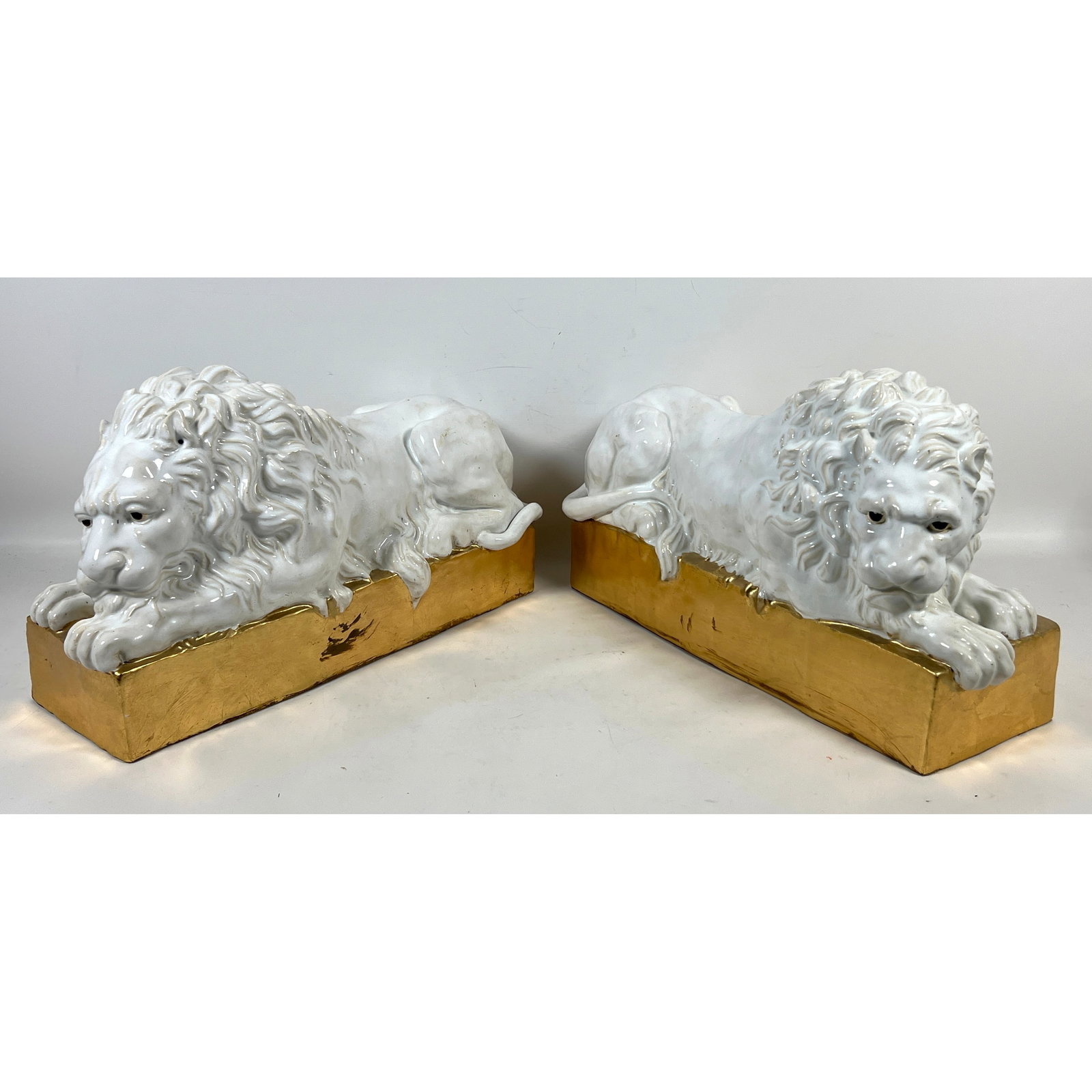 Pr Ceramic Italian glazed lions. Nicely Modeled Lion Forms. Metallic Gold Bases.: Pr Ceramic Italian glazed lions. Nicely Modeled Lion Forms. Metallic Gold Bases. Dimensions: Height: 12 inches, Width: 22 inches, Depth: 8.5 inches. ---