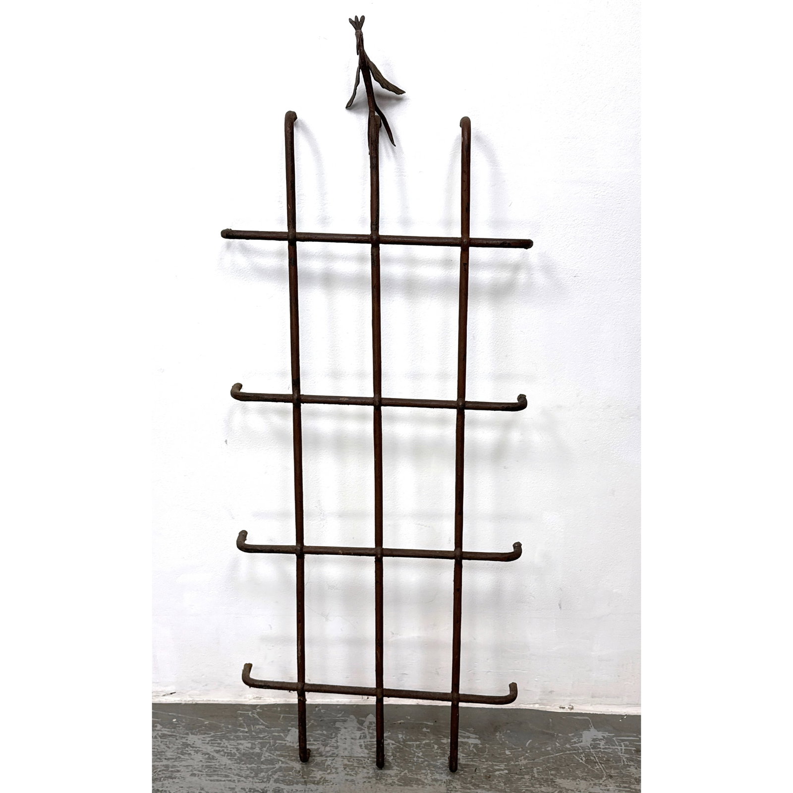 Antique Forged Iron Window Grate Trellis. Bird atop grid pattern.: Antique Forged Iron Window Grate Trellis. Bird atop grid pattern. Dimensions: Height: 58.5 inches, Width: 23 inches, Depth: 5 inches. ---