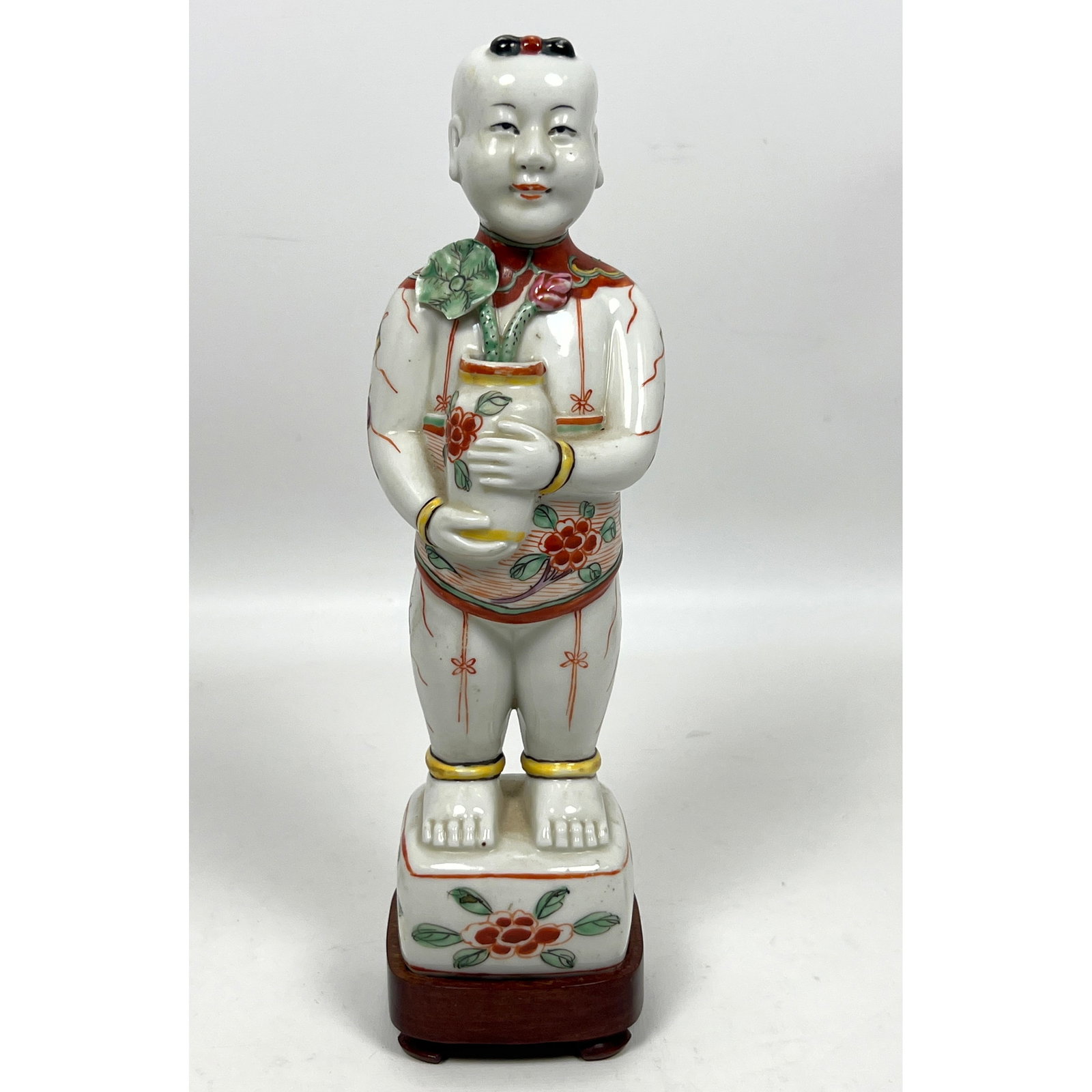 Chinese polychrome porcelain figurine of a standing youth, traditionally identified as a Lucky Boy o (1 of 10)