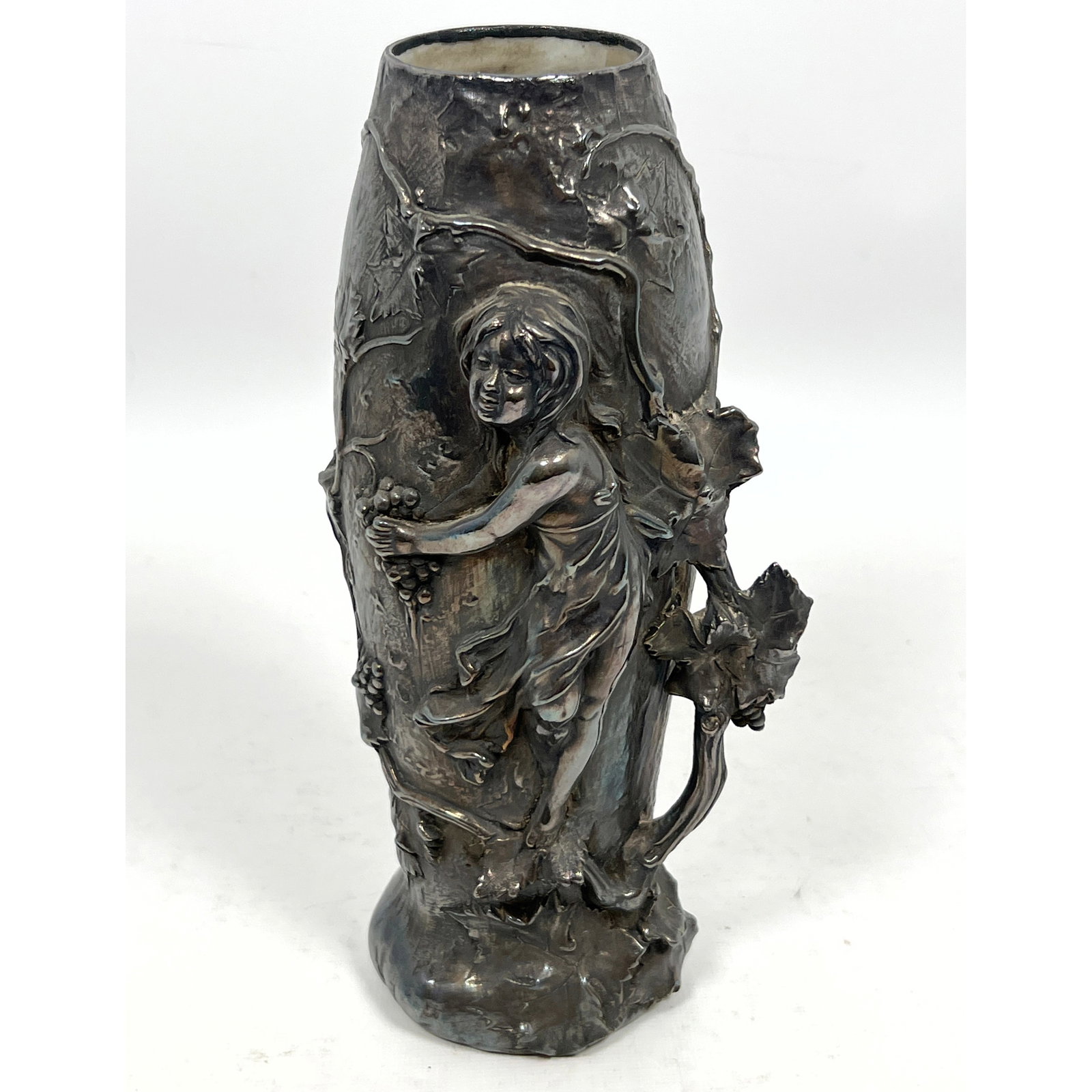 LA PIERRE Sterling Overlay Art Nouveau Vase. Sculptural form of young child clinging to vase. Vine a: LA PIERRE Sterling Overlay Art Nouveau Vase. Sculptural form of young child clinging to vase. Vine and berry motif. Marked. L Sterling, 4, 25V Dimensions: Height: 9.5 inches, Width: 5 inches, Depth: 3