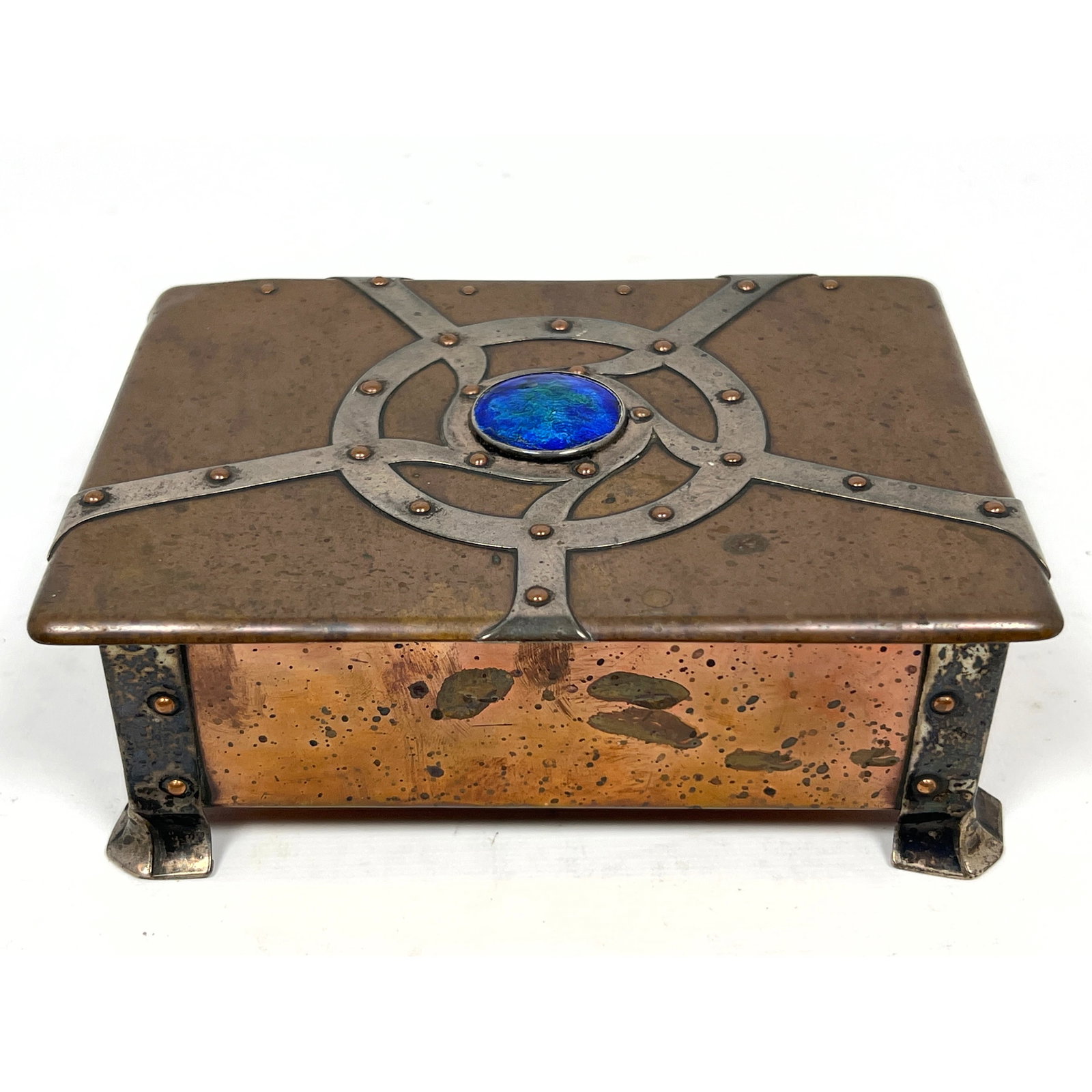 British Arts and Crafts silver and copper footed box produced for St. Dunstan Ware, attributed to th: British Arts and Crafts silver and copper footed box produced for St. Dunstan Ware, attributed to the designs of Albert Edward Jones. Enamel center Dimensions: Height: 2.25 inches, Width: 6 inches, De