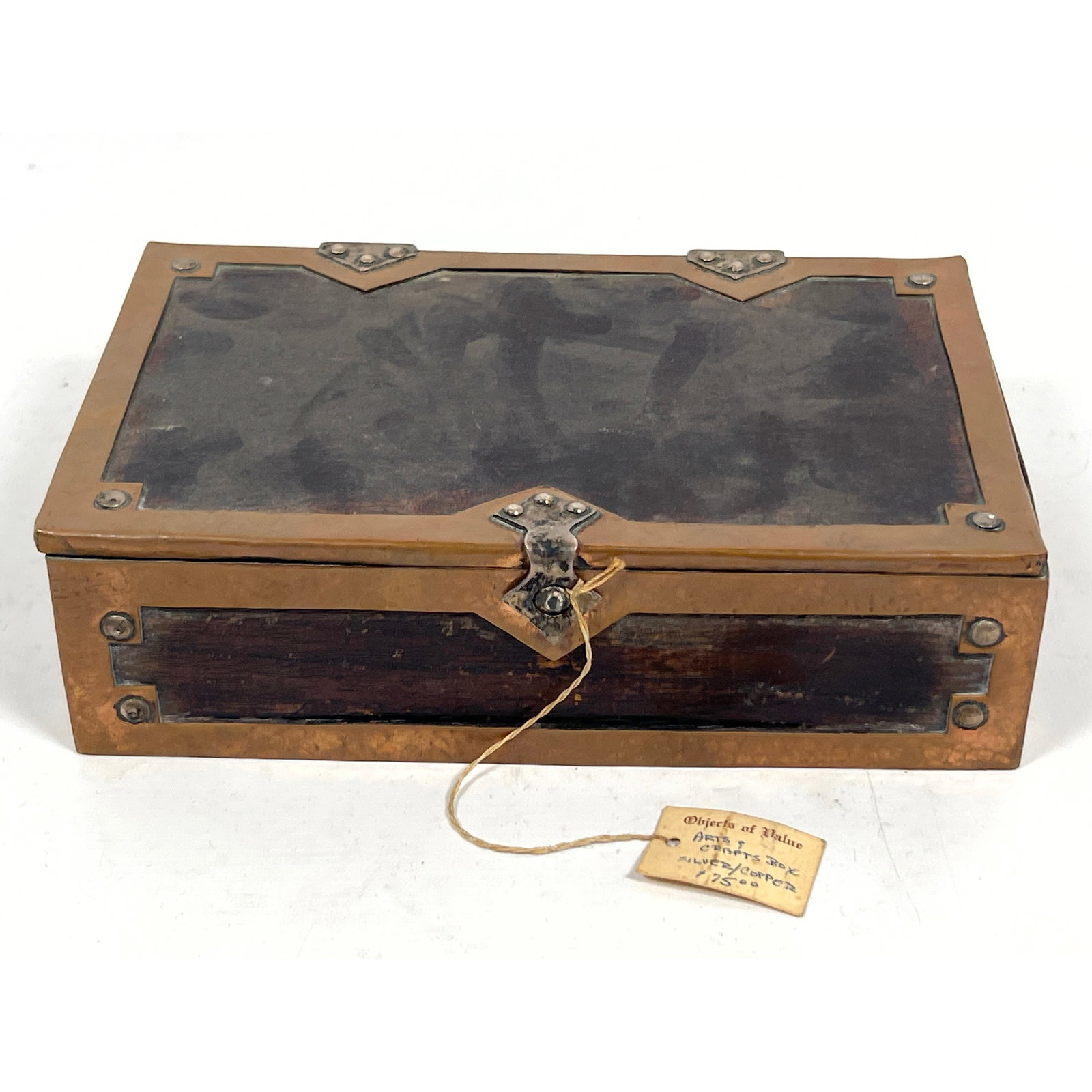 Early 20th century Arts and Crafts style rectangular jewelry or trinket box constructed from dark-st: Early 20th century Arts and Crafts style rectangular jewelry or trinket box constructed from dark-stained wood and Copper. Silver hinges and decoration. Dimensions: Height: 2.5 inches, Width: 8.75 inc