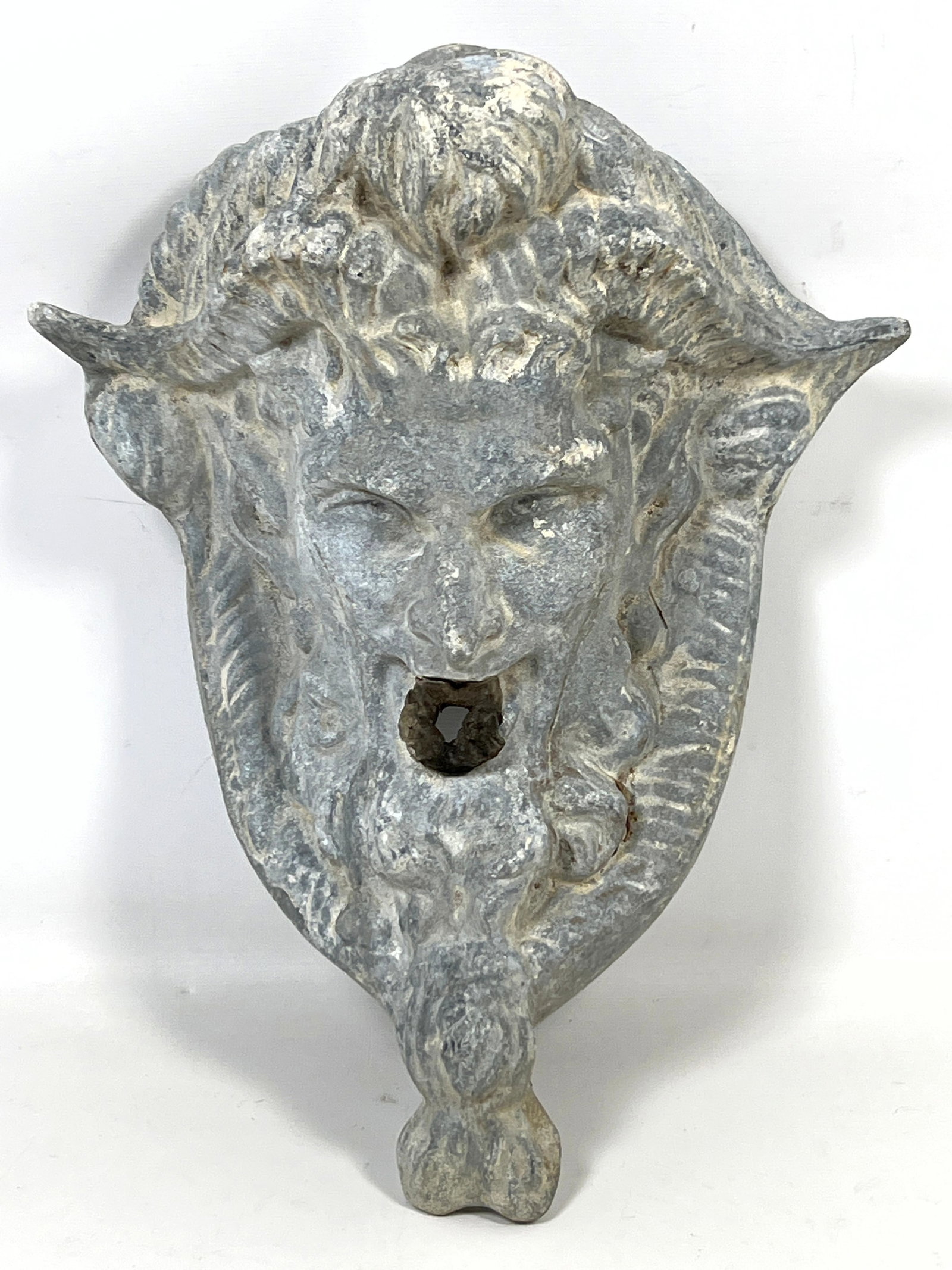 Cast lead wall fountain mask or mascaron depicting the head of a satyr or faun. (1 of 9)