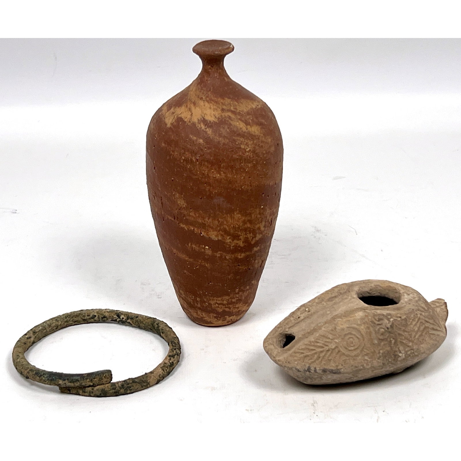 3pcs ancient artifacts originating from the Levant and Eastern Mediterranean regions. molded terraco: 3pcs ancient artifacts originating from the Levant and Eastern Mediterranean regions. molded terracotta oil lamp of the slipper type, attributed to the Byzantine period, fusiform terracotta unguentari