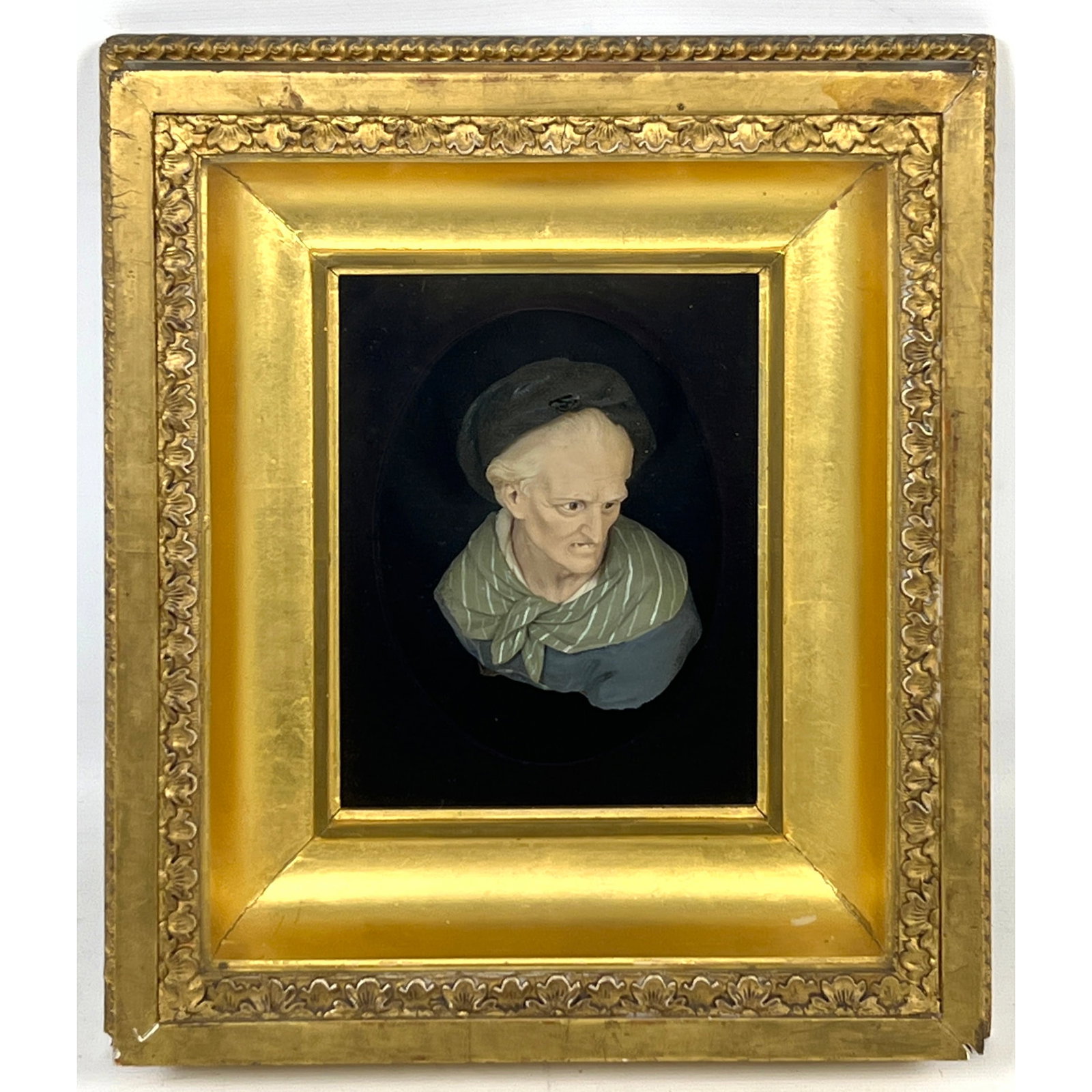 Antique Polychrome relief sculpture, likely rendered in wax, depicting a bust-length profile portrai: Antique Polychrome relief sculpture, likely rendered in wax, depicting a bust-length profile portrait of the French philosopher and writer Voltaire Dimensions: Height: 9.5 inches, Width: 8.5 inches. -