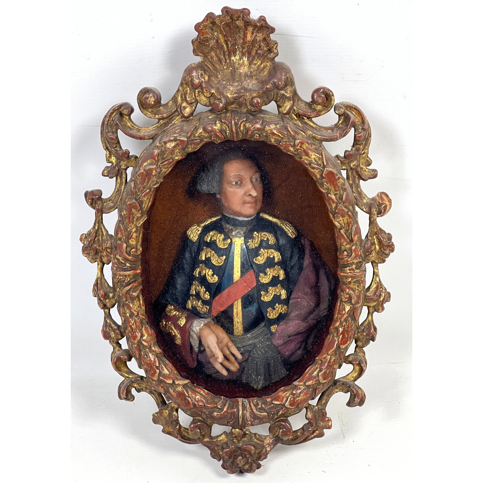 Antique polychrome wax carved relief portrait bust sculpture of a gentleman in military attire, dati: Antique polychrome wax carved relief portrait bust sculpture of a gentleman in military attire, dating to the late 18th century Dimensions: Height: 11.25 inches, Width: 7.5 inches. --- US Packing and 