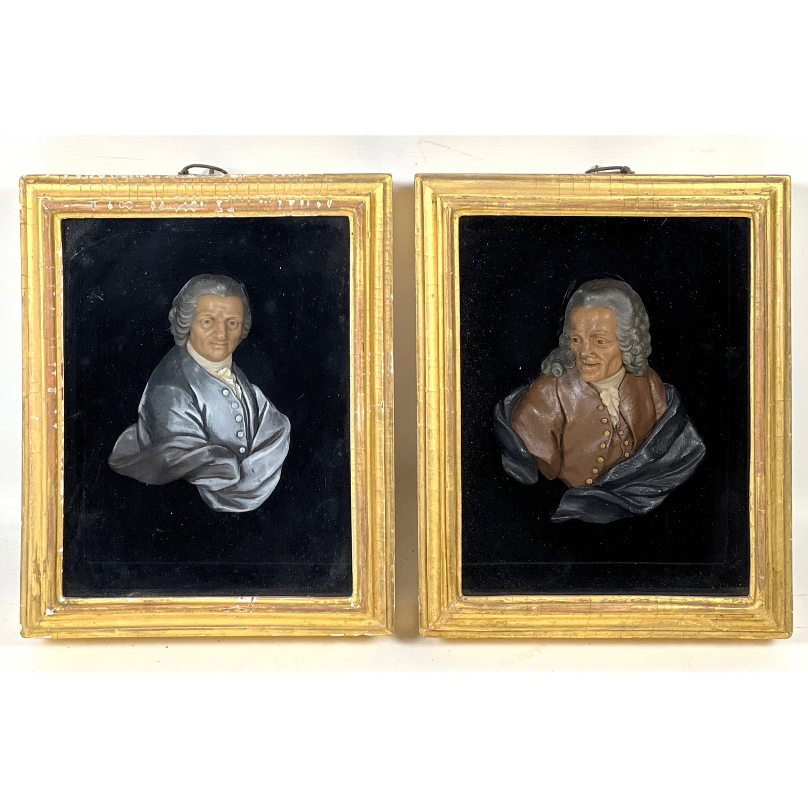 Matched Pair Antique polychrome wax relief Carved sculptures depicts two of the most significant fig: Matched Pair Antique polychrome wax relief Carved sculptures depicts two of the most significant figures of the French Enlightenment: philosopher Jean-Jacques Rousseau and the writer Voltaire (Francoi