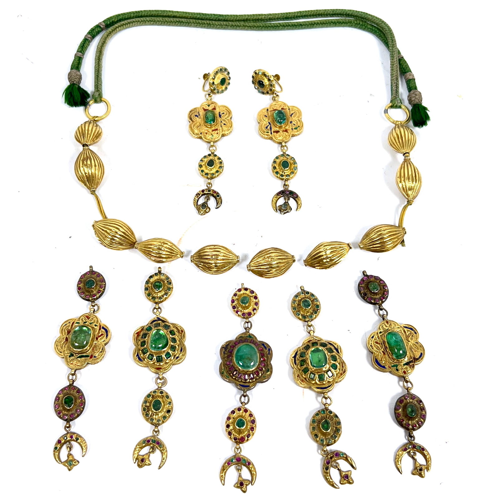 High Karat 18k Plus Indo-Persian Mughal Cord Necklace in Parts. Set with Rubies and Peridot. 2 drop: High Karat 18k Plus Indo-Persian Mughal Cord Necklace in Parts. Set with Rubies and Peridot. 2 drops converted to earrings. Professionally tested. Dimensions: Height: 4 inches, Width: 1 inches, Depth: