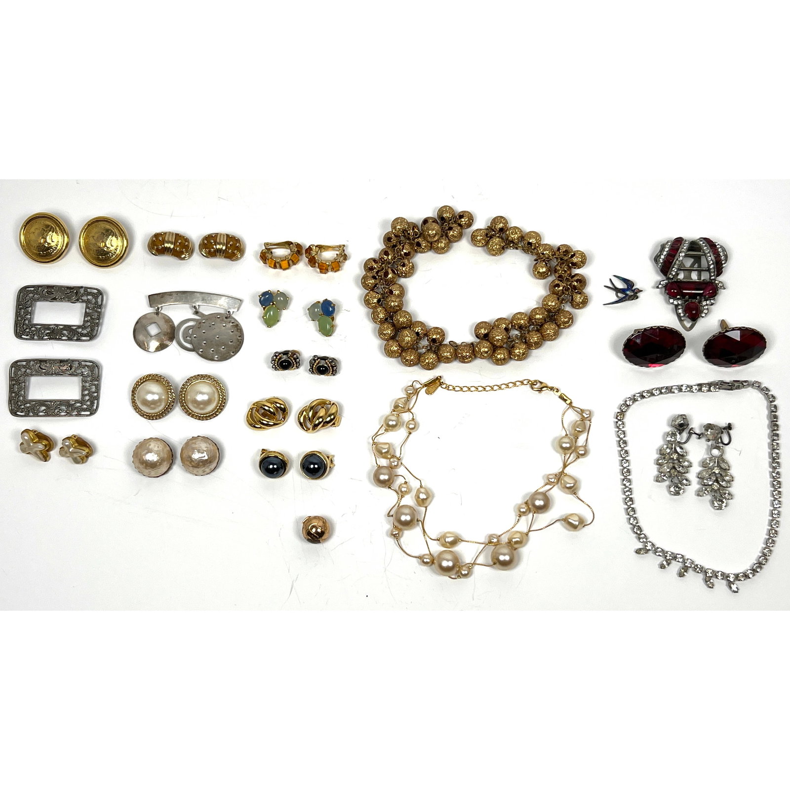 Collection of Vintage Costume Jewelry. One Sterling Mexican Pin. Lovely Faux Ruby Art Deco Dress Cli: Collection of Vintage Costume Jewelry. One Sterling Mexican Pin. Lovely Faux Ruby Art Deco Dress Clip. Shoe Clips. Bead Necklaces. Large assortment of gold tone clip earrings. Large pearls 18 Dimensio