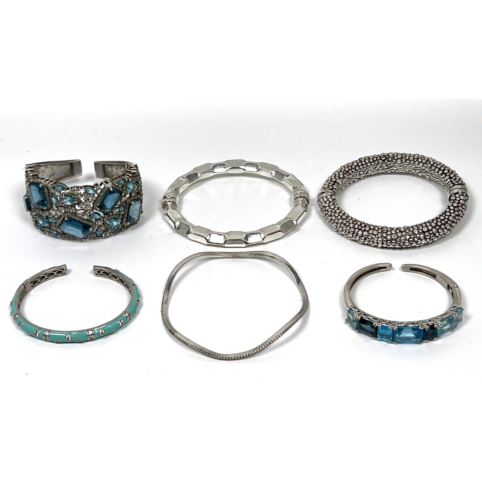 Collection 6 Sterling and .950 Silver Bracelets. Two Hinged Bracelets with Assorted Faceted Blue Gem: Collection 6 Sterling and .950 Silver Bracelets. Two Hinged Bracelets with Assorted Faceted Blue Gemstones. Three Sculptural Bracelets. All Marked. Dimensions: Height: 3 inches, Width: 3.25 inches, De