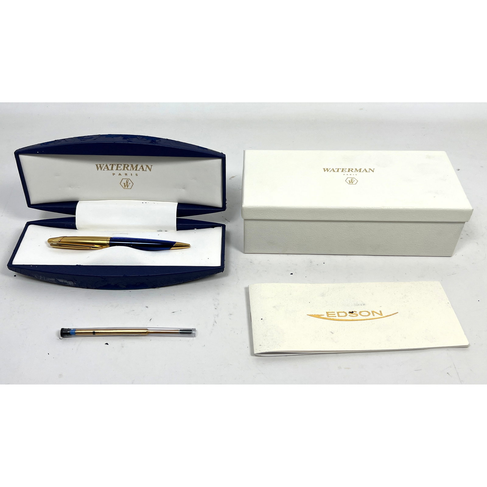 Waterman Edson ballpoint pen features a translucent sapphire blue resin barrel and satin-finished go: Waterman Edson ballpoint pen features a translucent sapphire blue resin barrel and satin-finished gold-plated cap and trim. Stylo Bille. Dimensions: Height: 3 inches, Width: 9 inches, Depth: 4 inches.